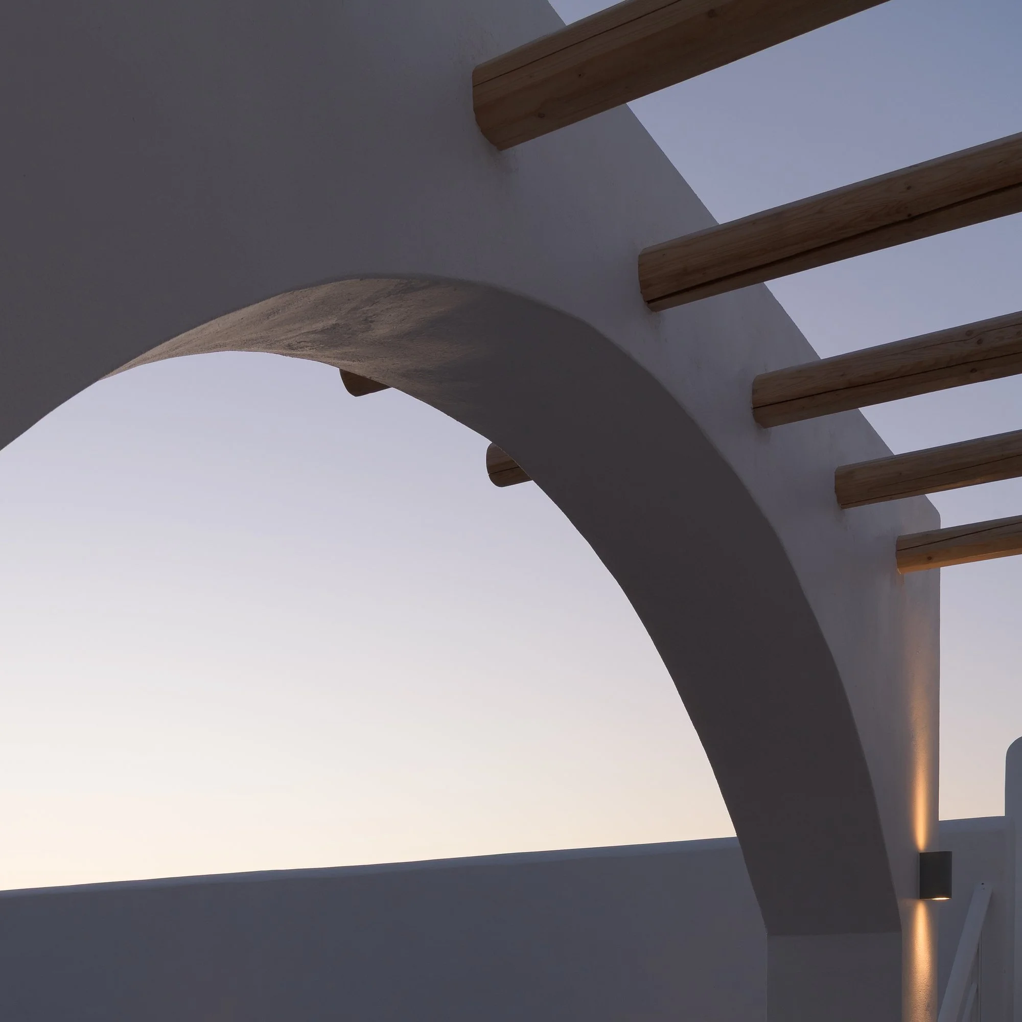 Cycladic-inspired arches and Mediterranean architecture at Galini Breeze adults-only retreat.