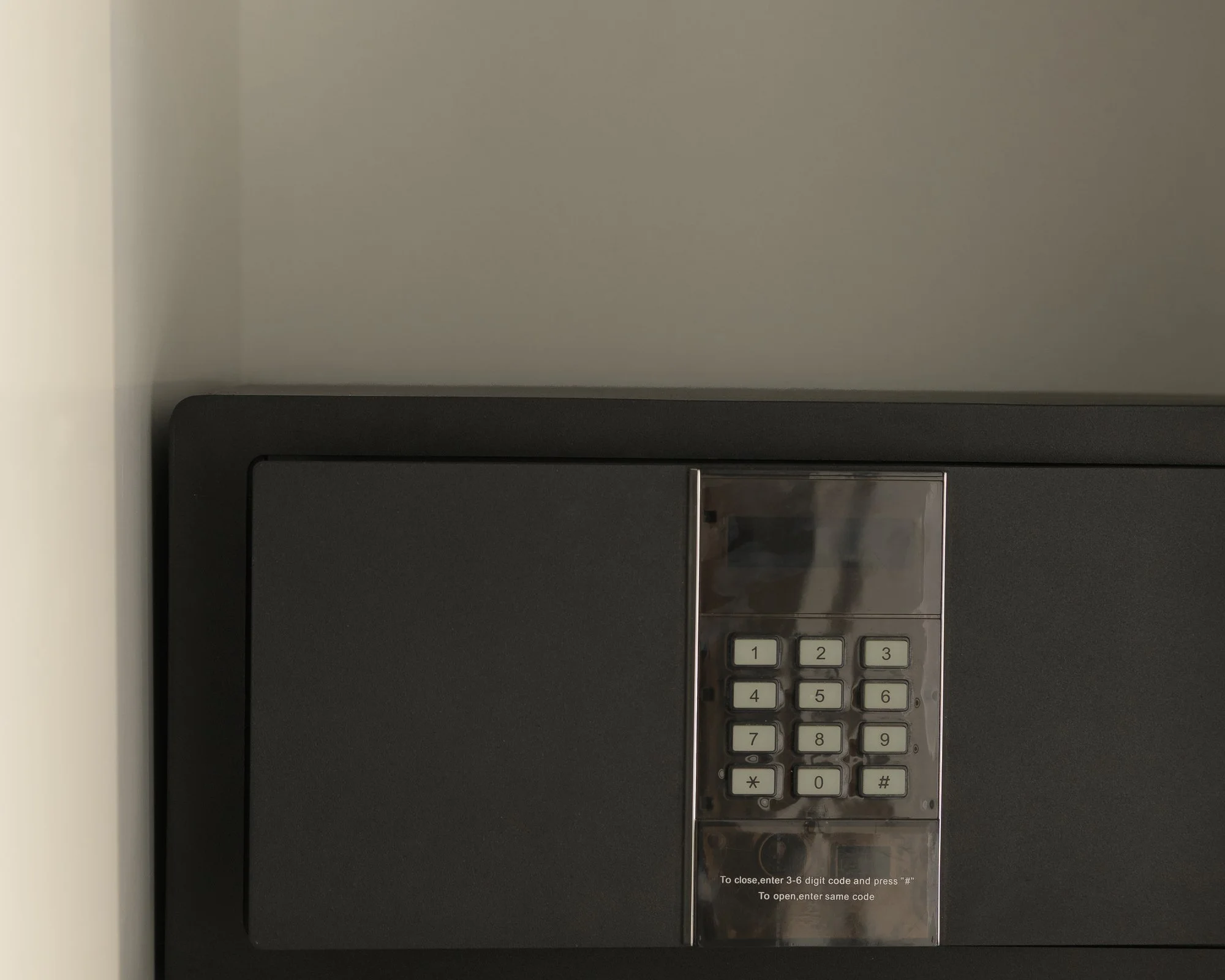 In-room digital safe and premium security amenities at Galini Breeze adults-only accommodation.