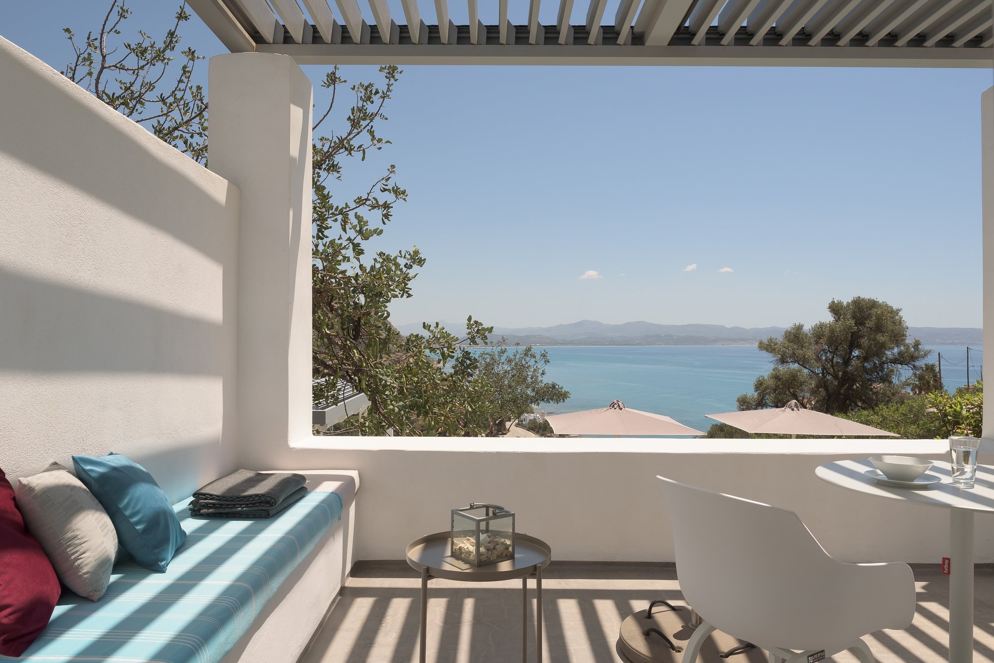 Private outdoor lounge with sea views and pergola shade near the Libyan Sea in South Crete.