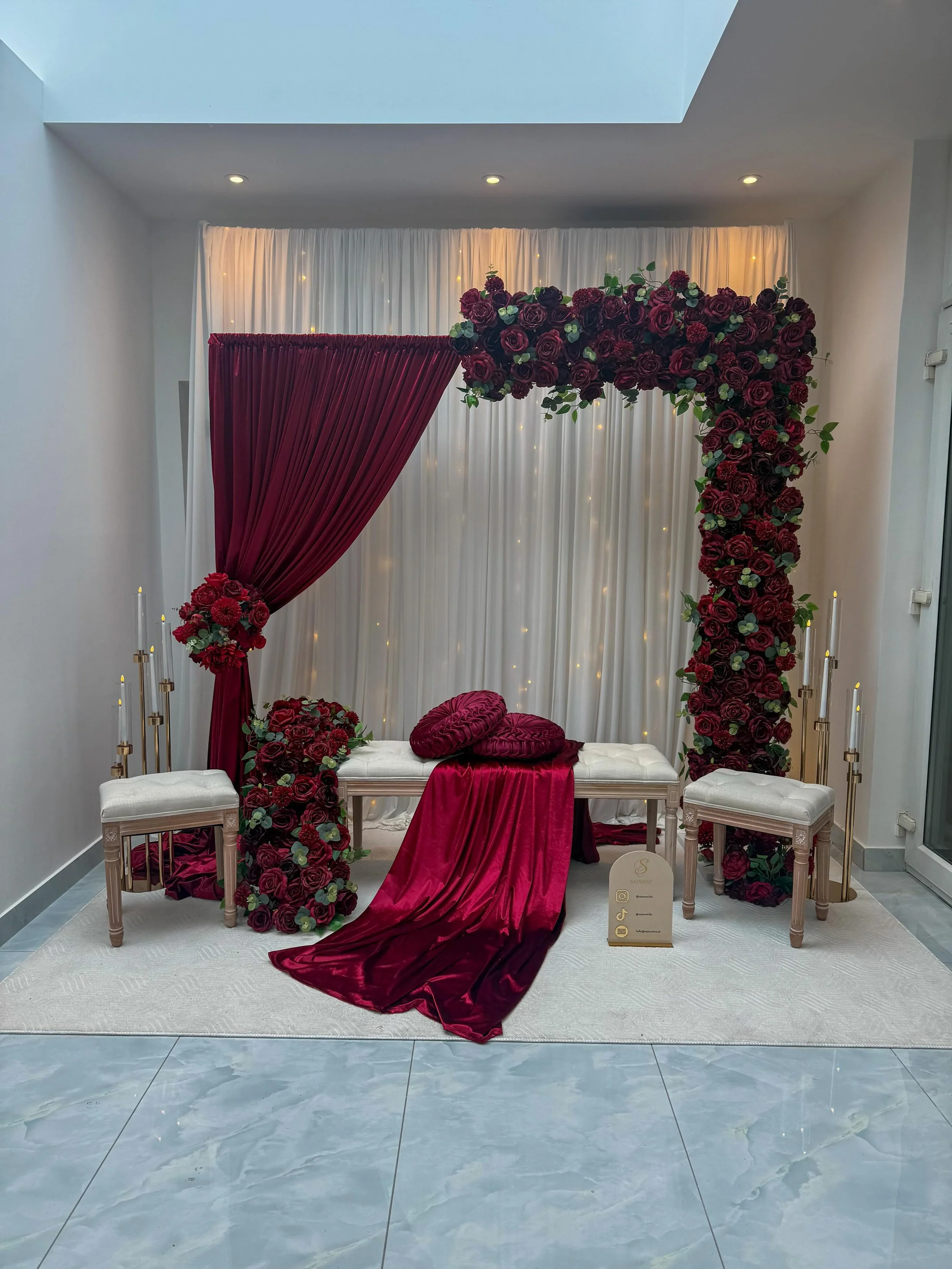A rich red setup with cascading blooms and soft draping 🌹
Dm for enquiries 

 #LuxuryWedding #ElegantSetup #WeddingStage #Weddingdecor #EventStyling FloralDesign