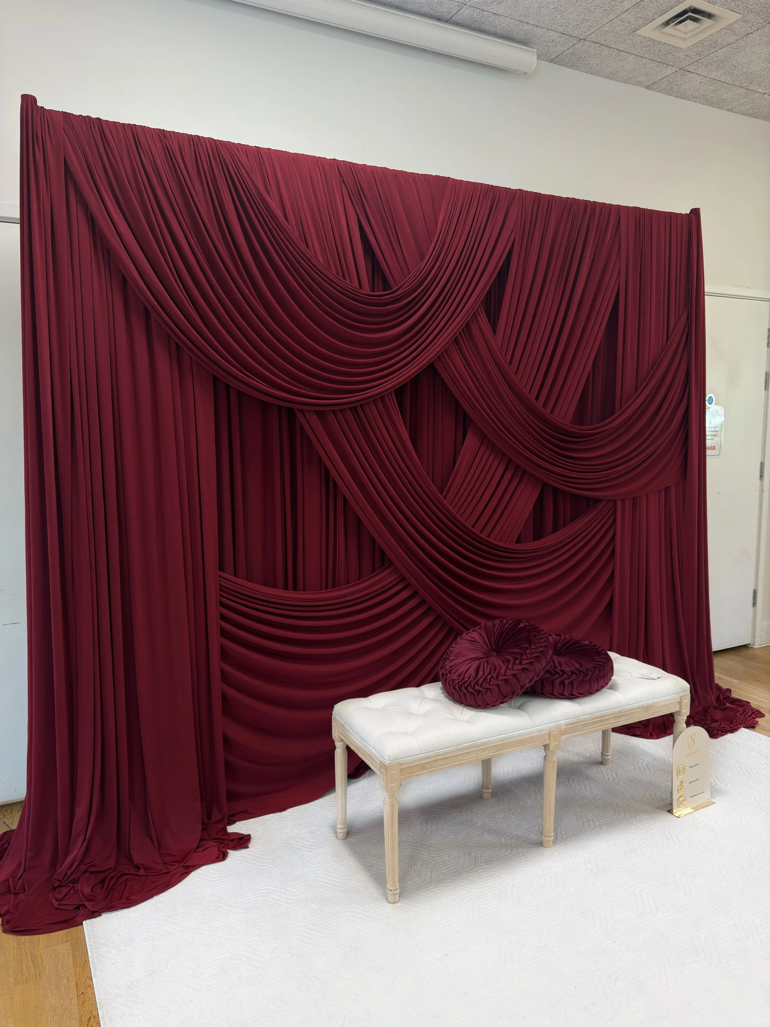 Draped backdrop obsessed- another burgundy draped backdrop 
Dm for enquiries 

 #LuxuryWedding #ElegantSetup #WeddingStage #Weddingdecor #EventStyling FloralDesign