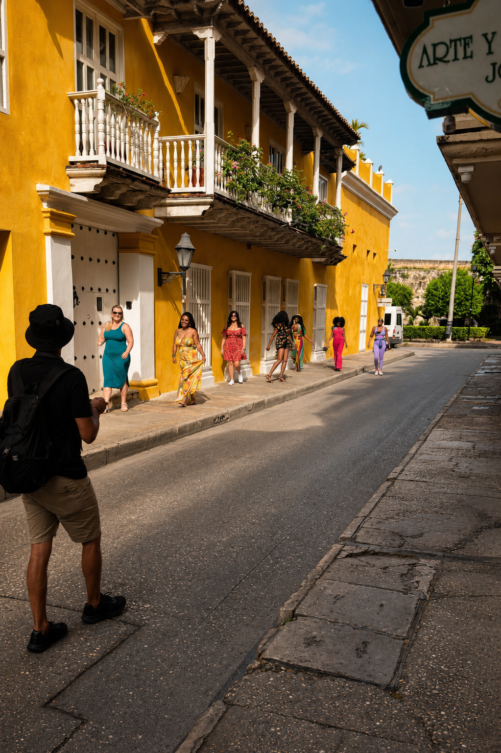 Women in colorful dresses during a cultural walking tour in Cartagena