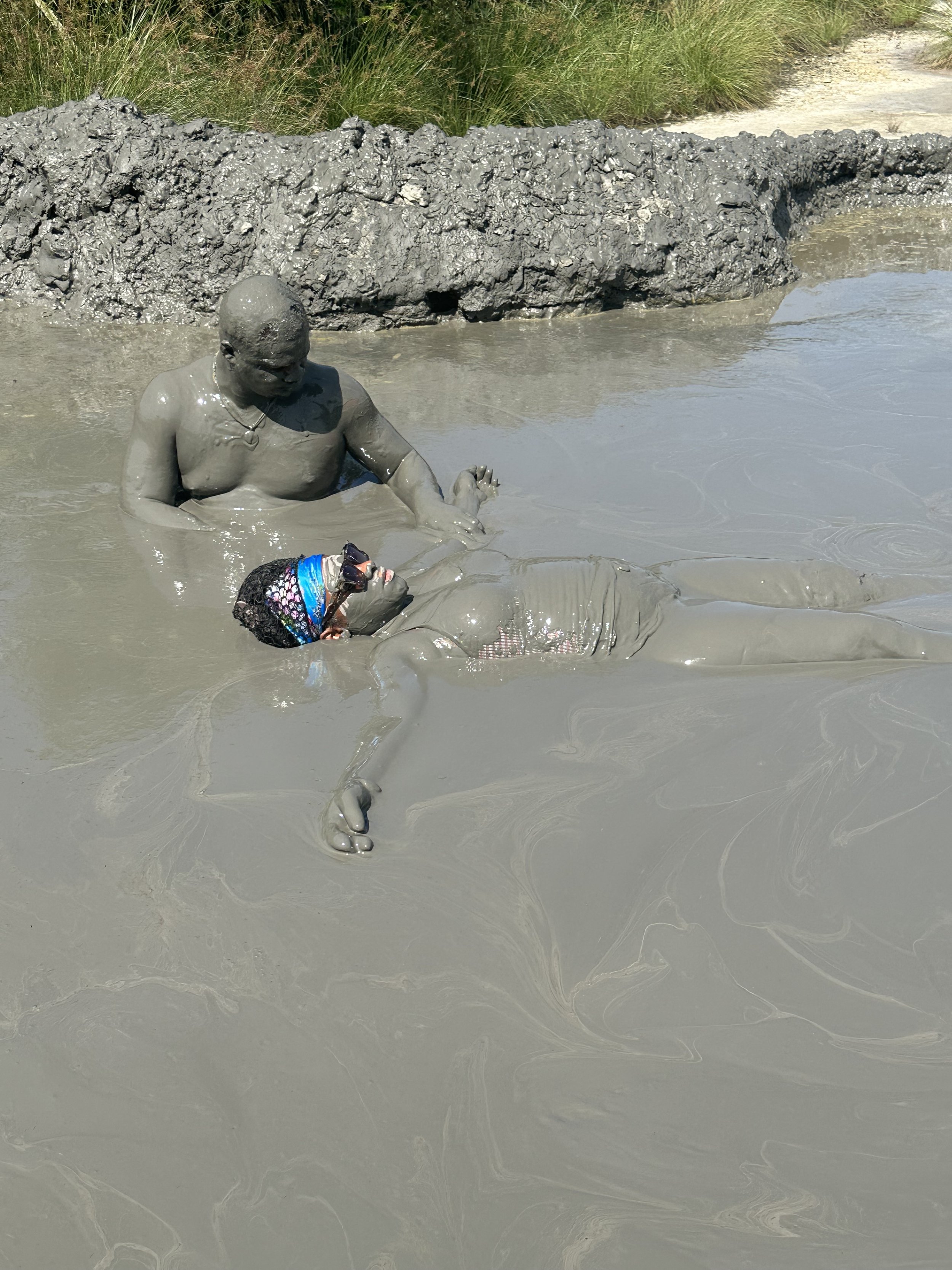 Visitors bathing in the mud at the private mud volcano in Turbaco