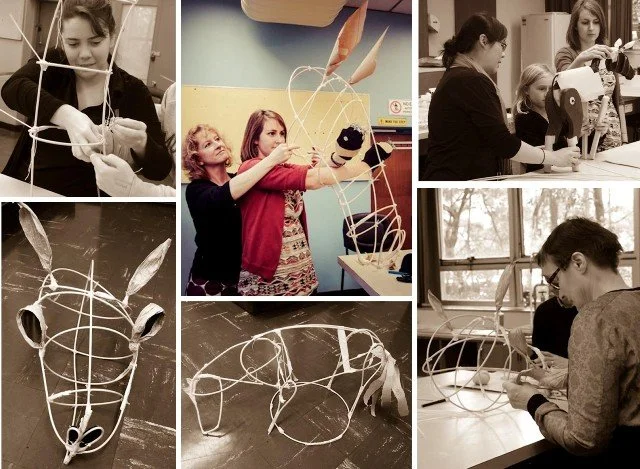 People creating and assembling animal-shaped wire sculptures for an art project or workshop.