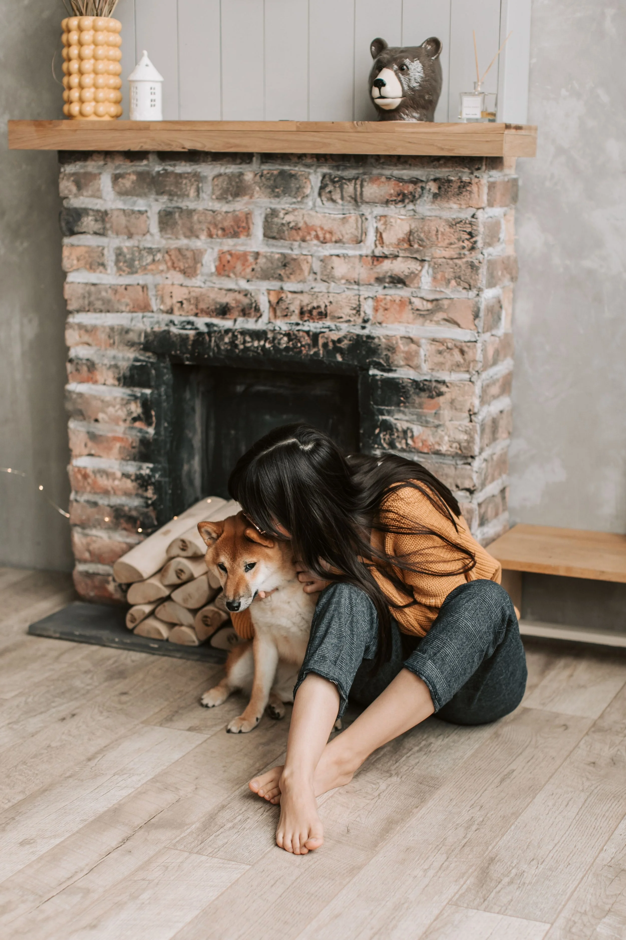 Person cuddling a therapy dog, demonstrating comfort, emotional support, and grounding during animal-assisted therapy.