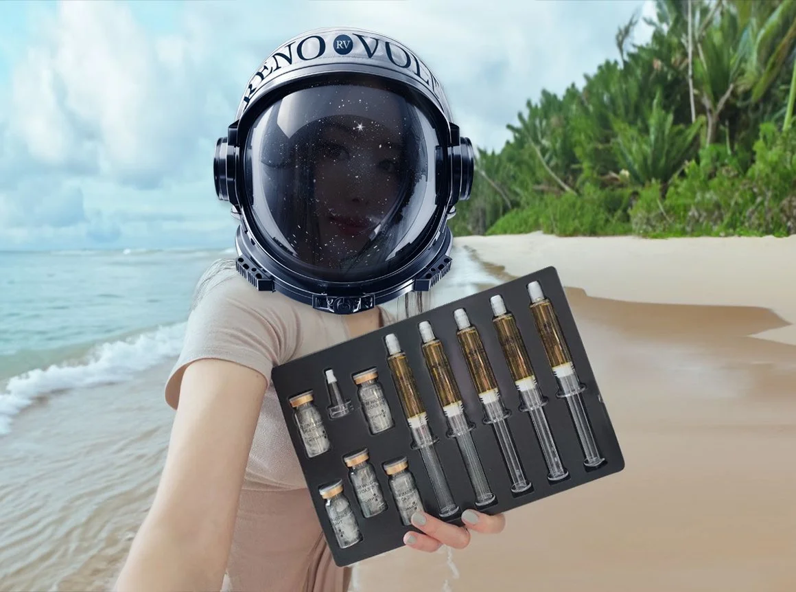 Person in a space helmet holding a tray of small vials on a beach with trees in the background.