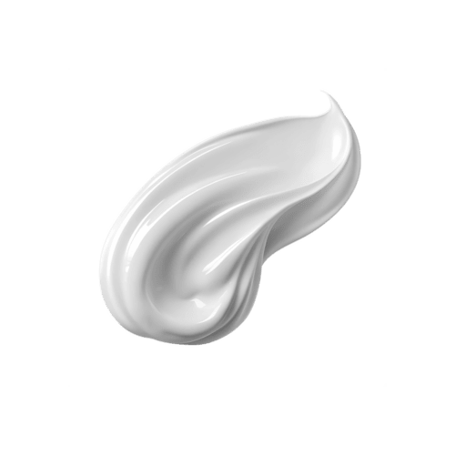 A dollop of white cream or lotion on a gray background.