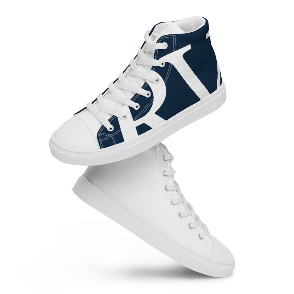 A sneaker with a white base and navy blue accents, featuring a stylized white 'X' design on the side, reflected on a glossy surface.