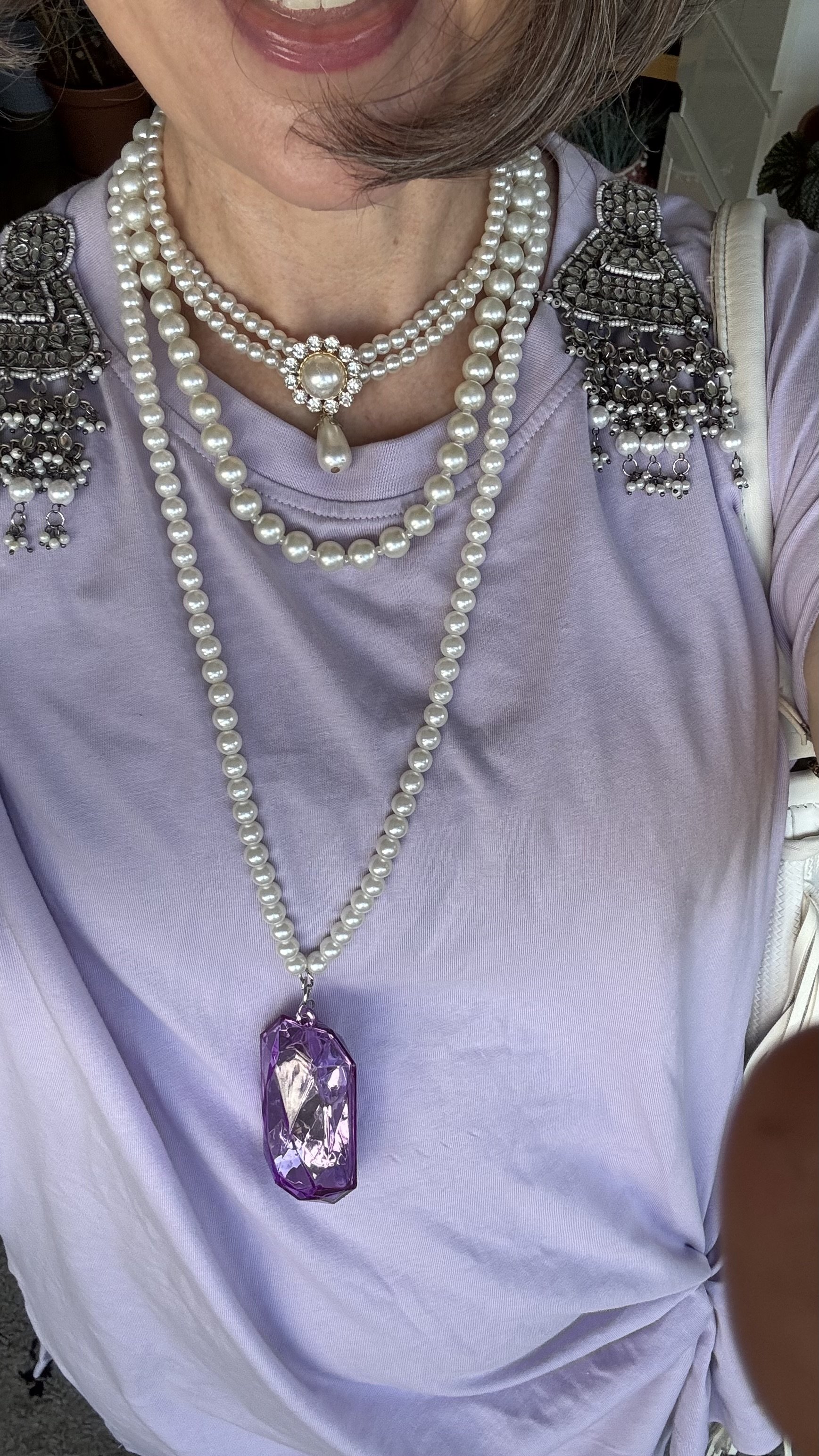 reative layered outfit over 40 — lilac tee- pearls- earrings pinned to t-shirt - women's style over 40