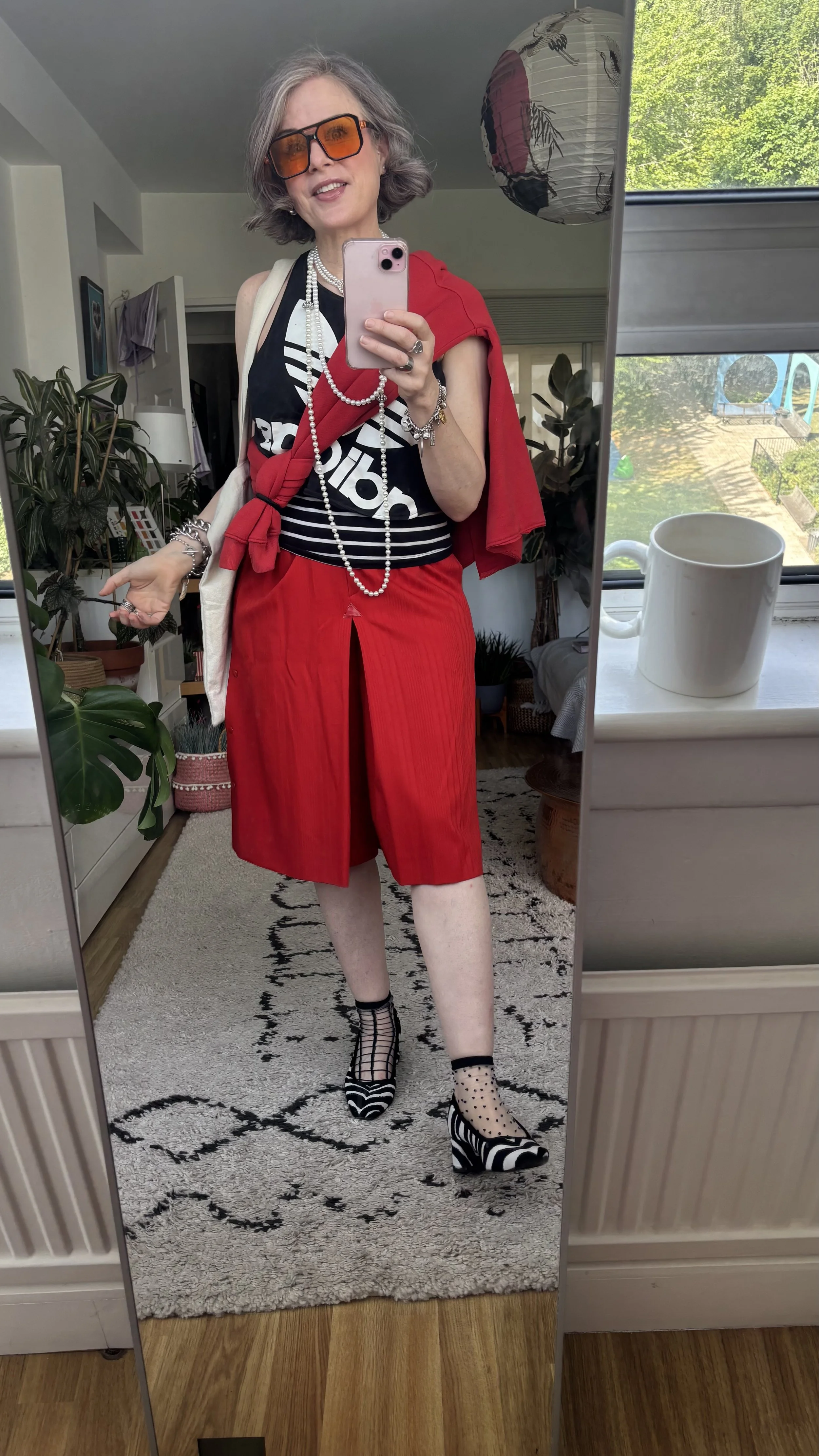 Bold summer outfit over 40 — red vintage shorts, Adidas logo top, pearl necklace, zebra print heels — style diary The Holistic Personal Stylist