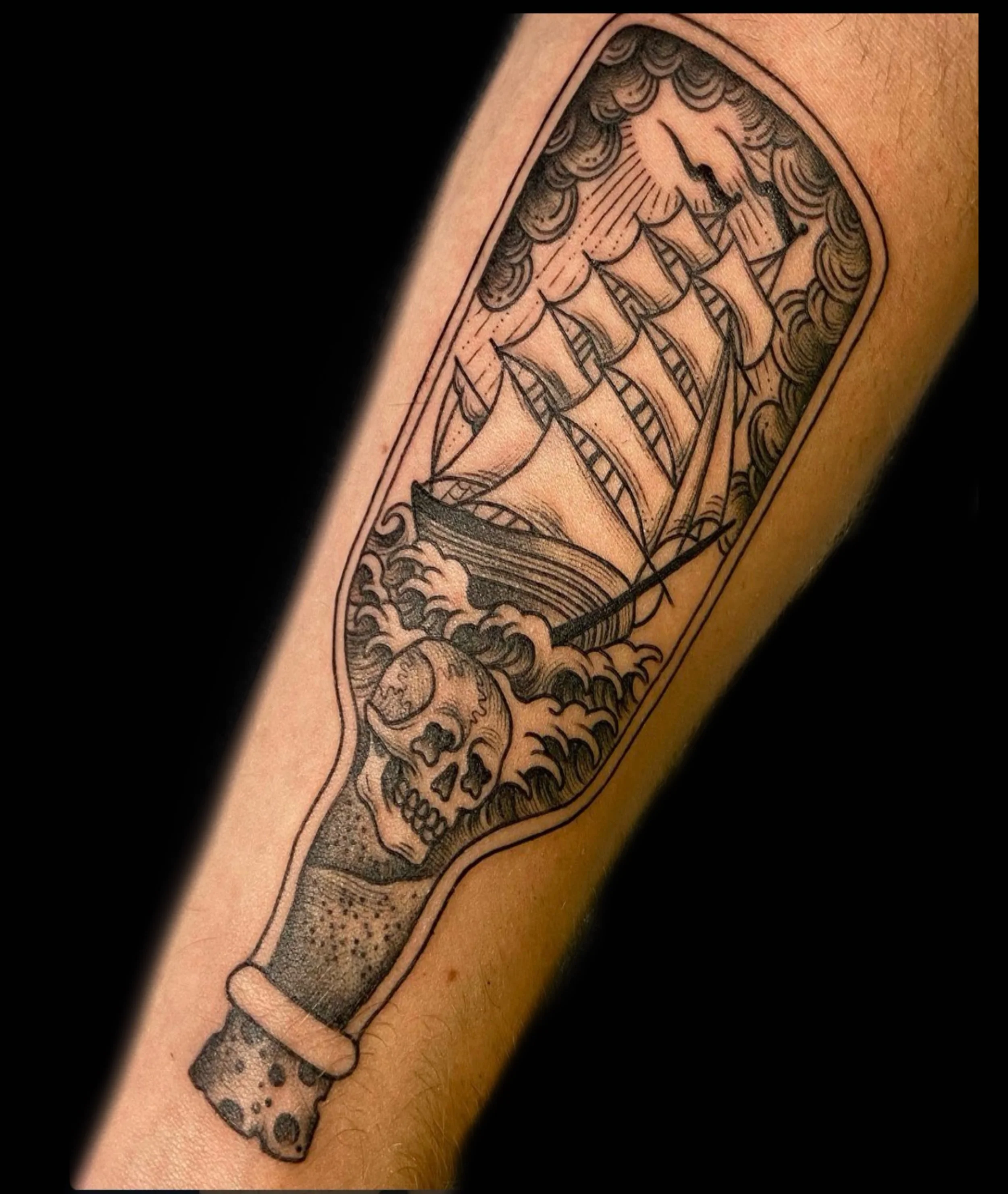 traditional style ship in bottle tattoo black and grey