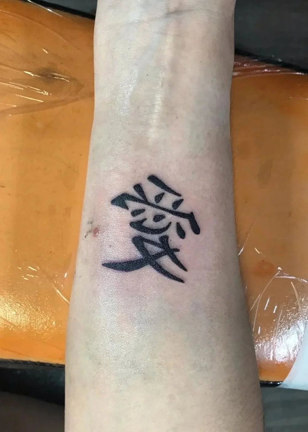 kanji tattoo black on wrist 