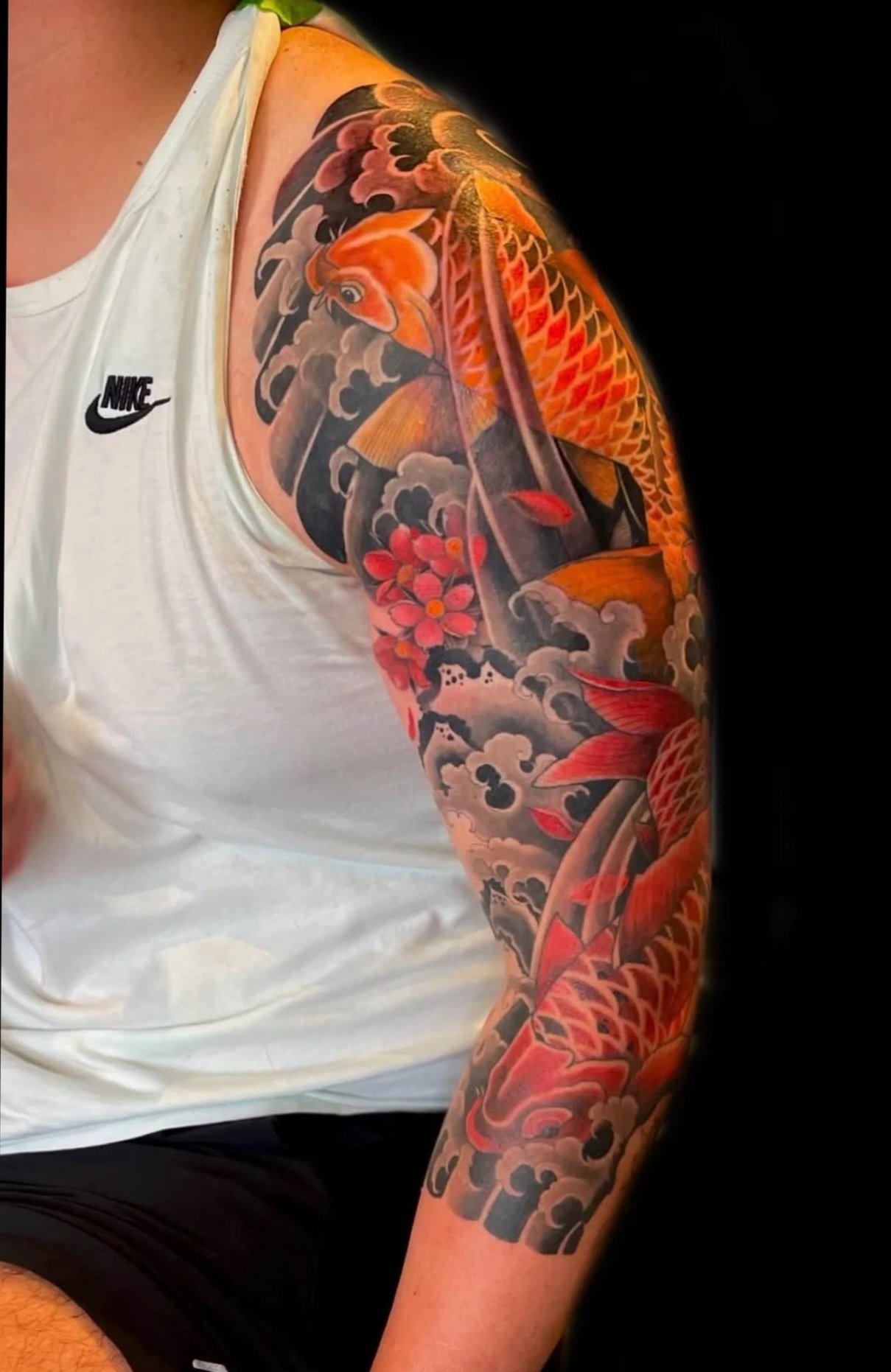 japanese koi sleeve tattoo with waves in color 