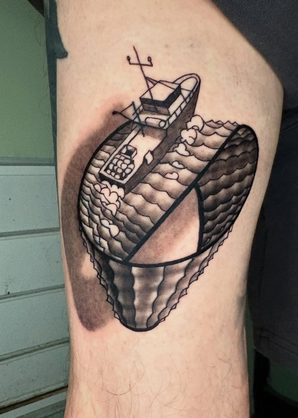 fishing boat black and grey tattoo on the leg