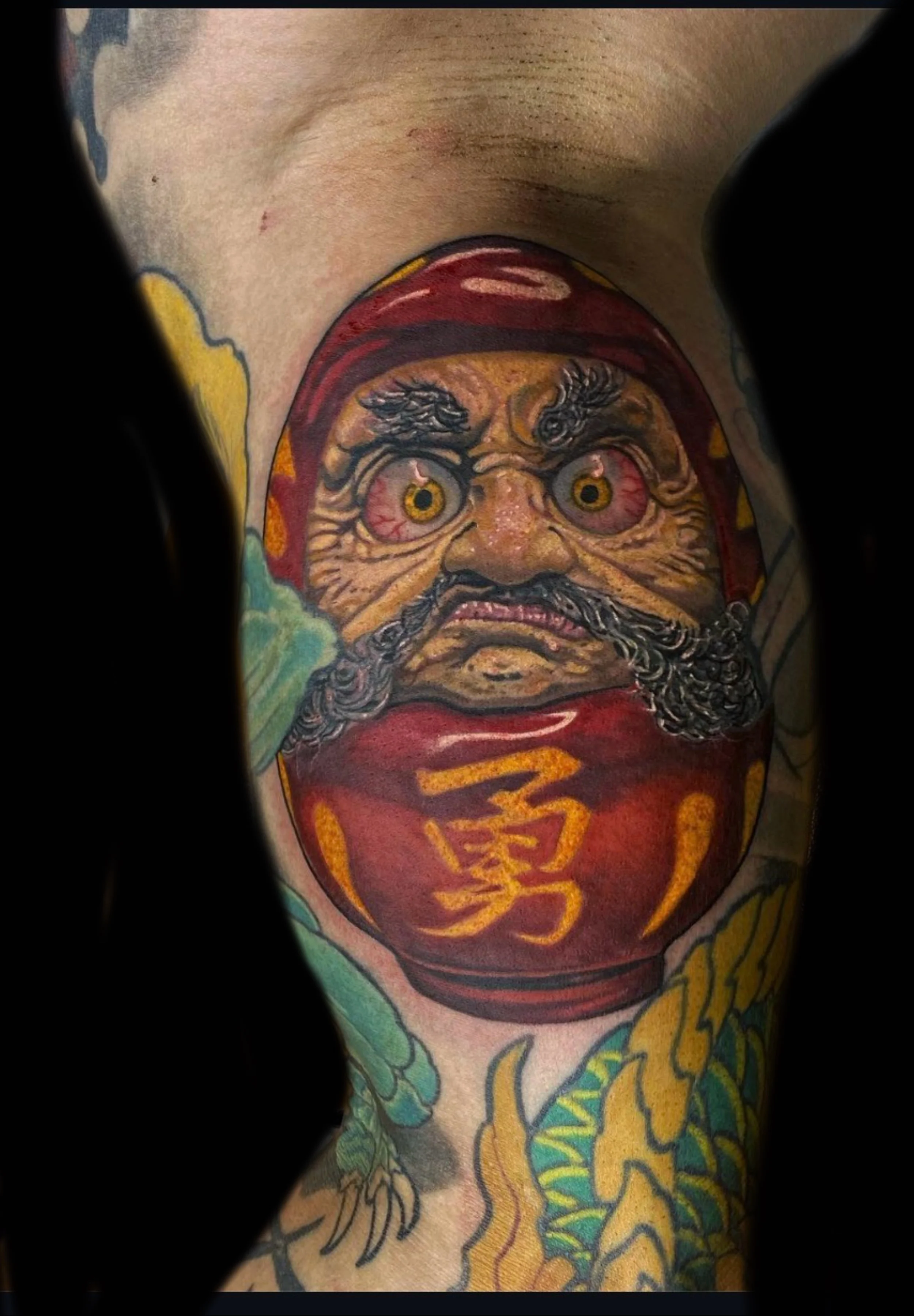 Japanese Daruma doll color tattoo