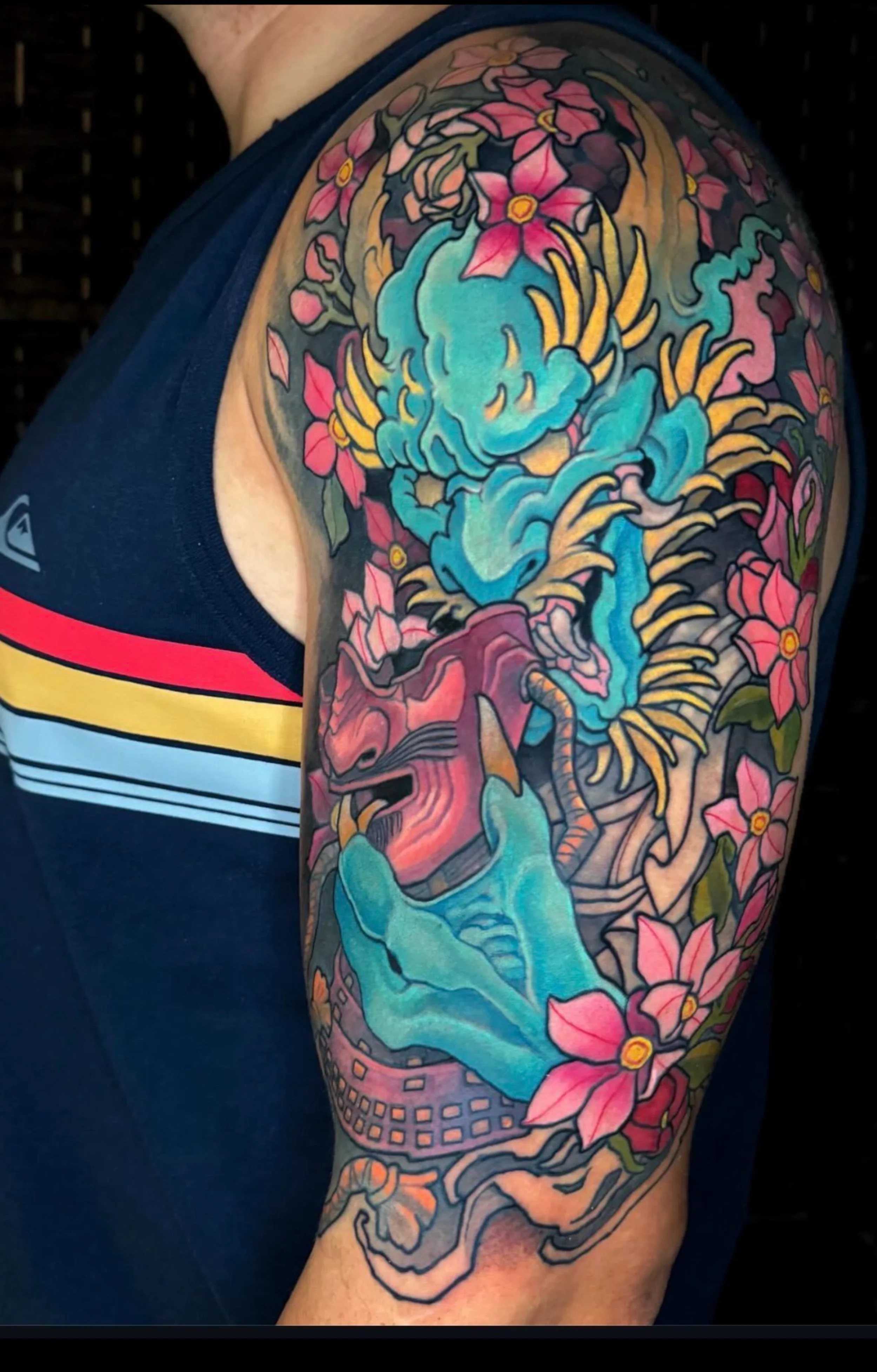 Blue and green Japanese Oni tattoo with Sakura background