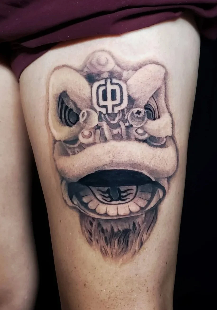 Black-and-grey-tattoo-lion-dance-by-Zach-Yokoyama.jpg
