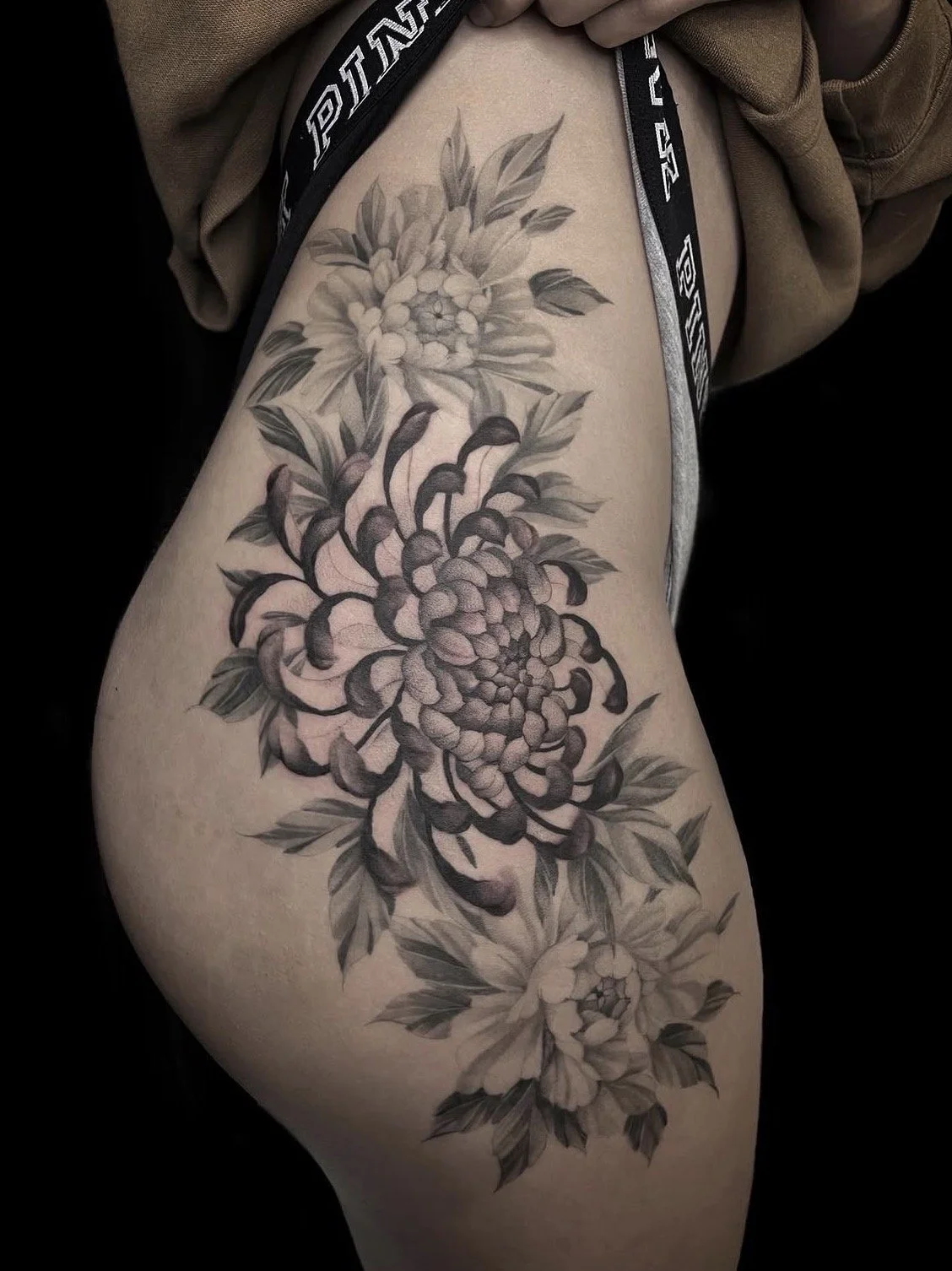 Black and gray floral tattoo by Marie Makowski