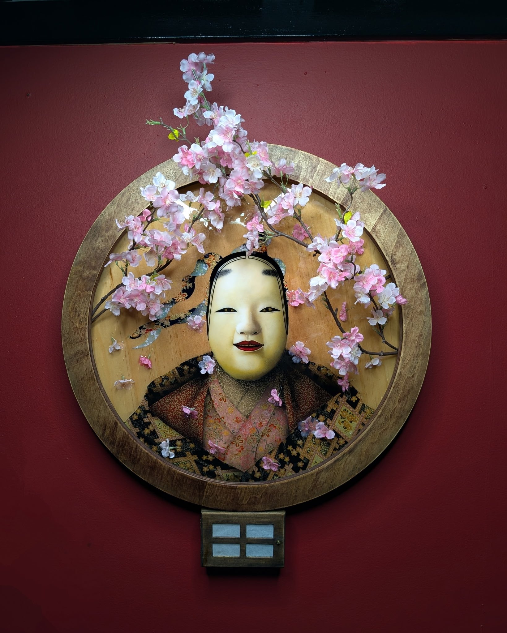 japanese mask with sakura and wood working artwork