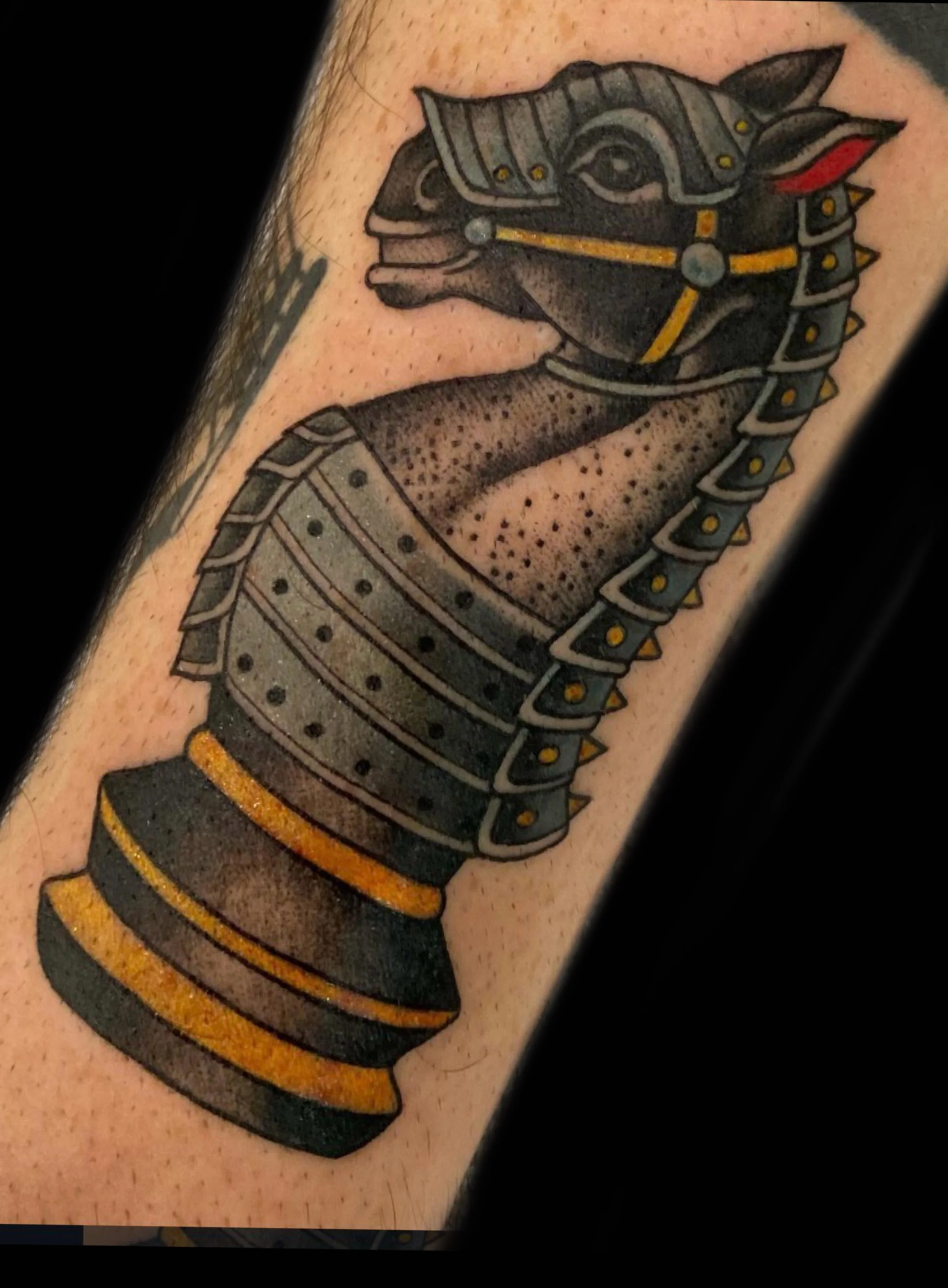 Traditional tattoo of a medieval chess knight by Sue Kidder
