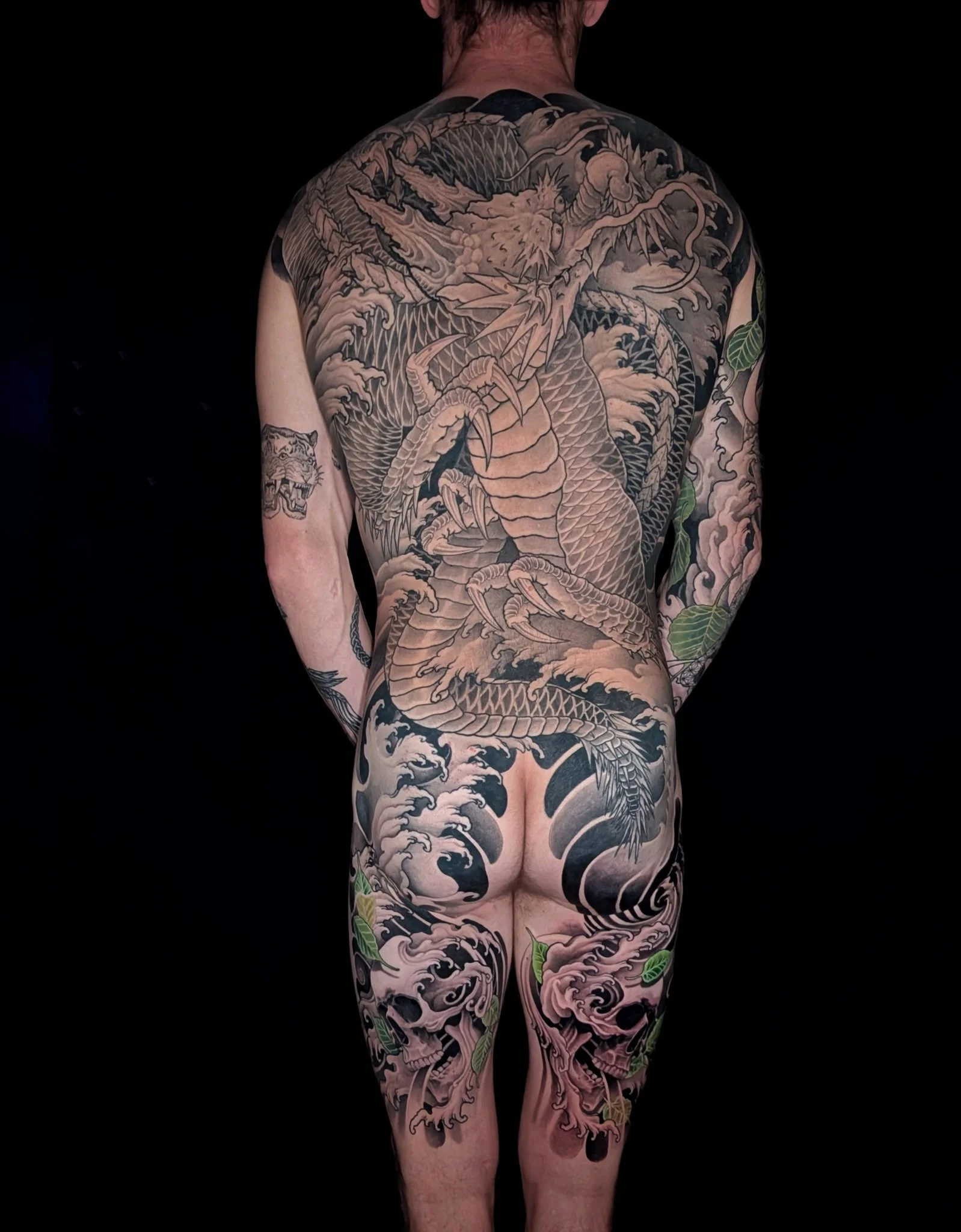 Full back tattoo of a Japanese dragon by Zach Yokoyama