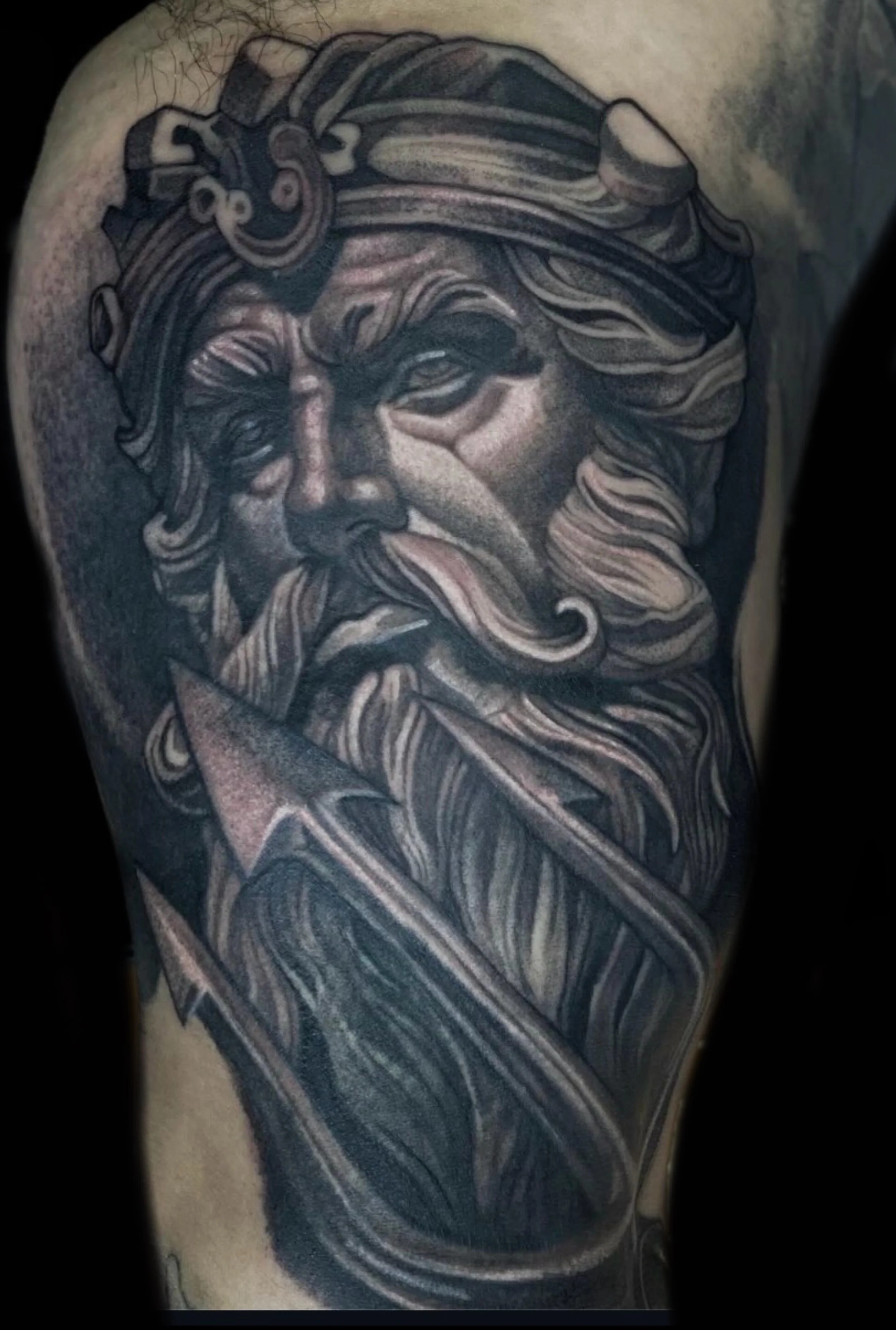 Black and grey mythological bearded warrior portrait tattoo
