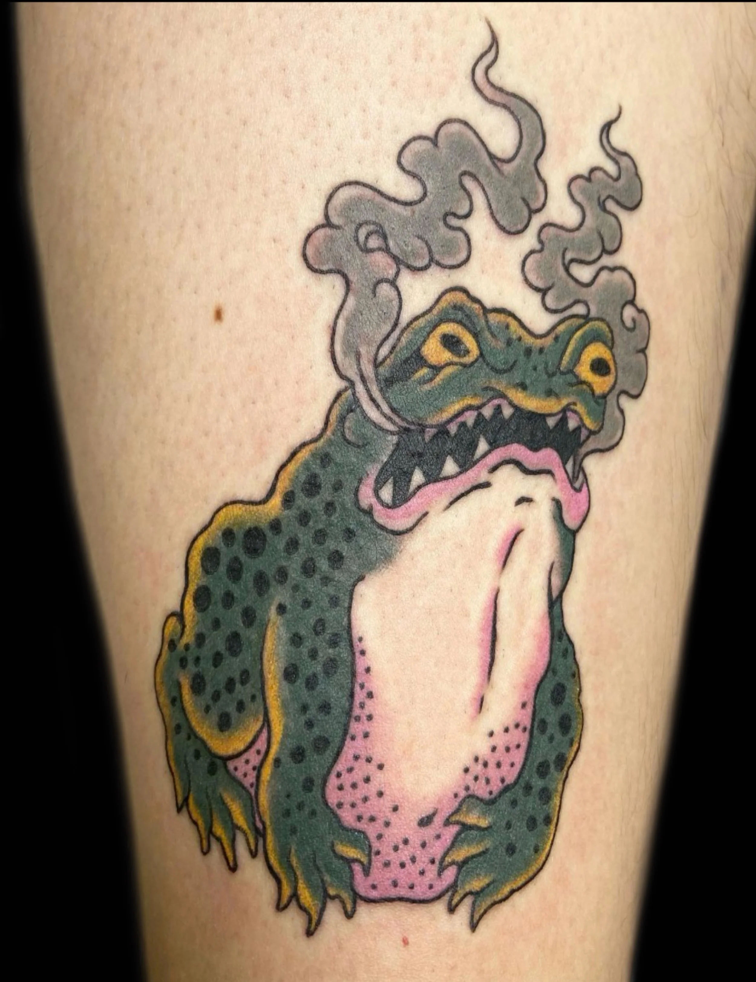 Tattoo of a green toad by Sue Kidder