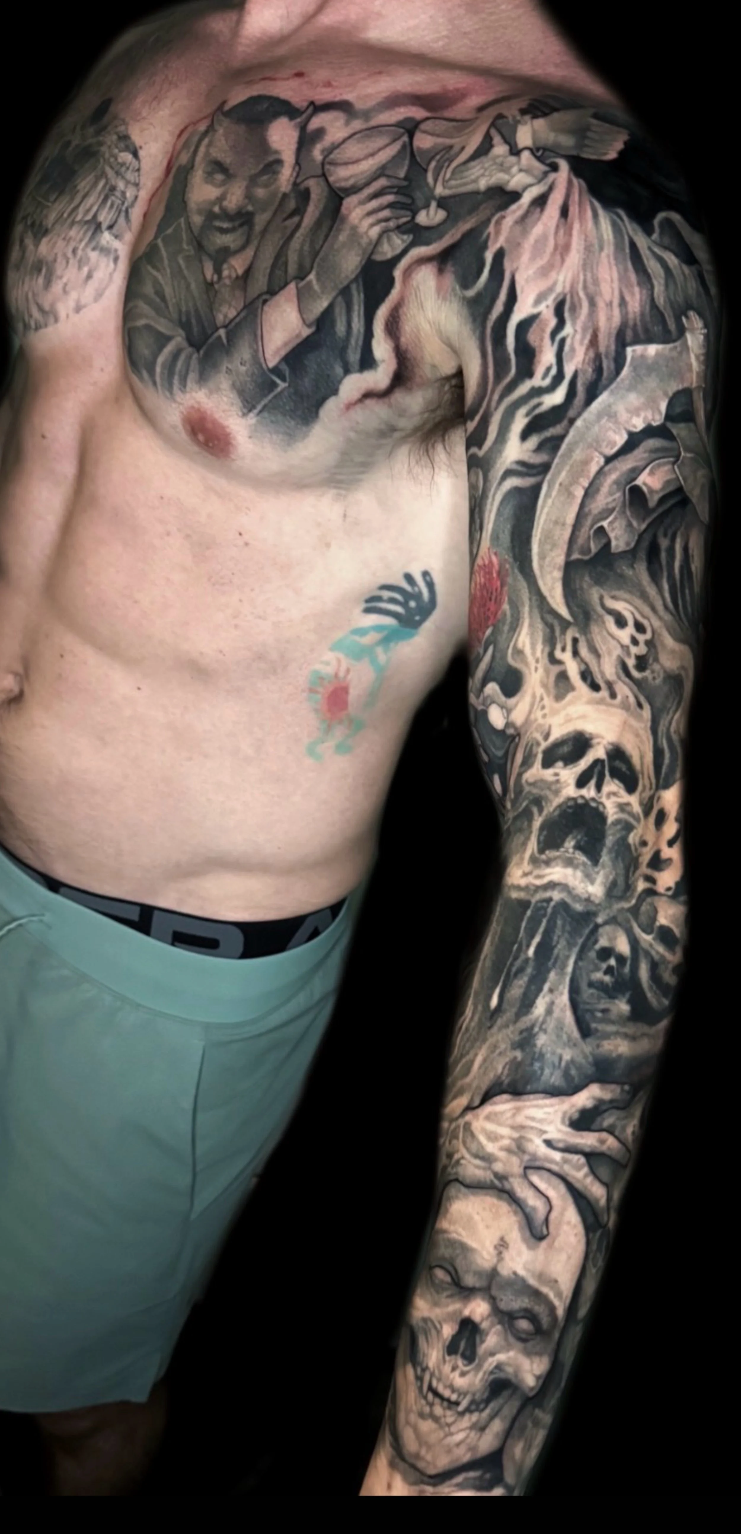 black and grey demonic sleeve by Richie Lucero