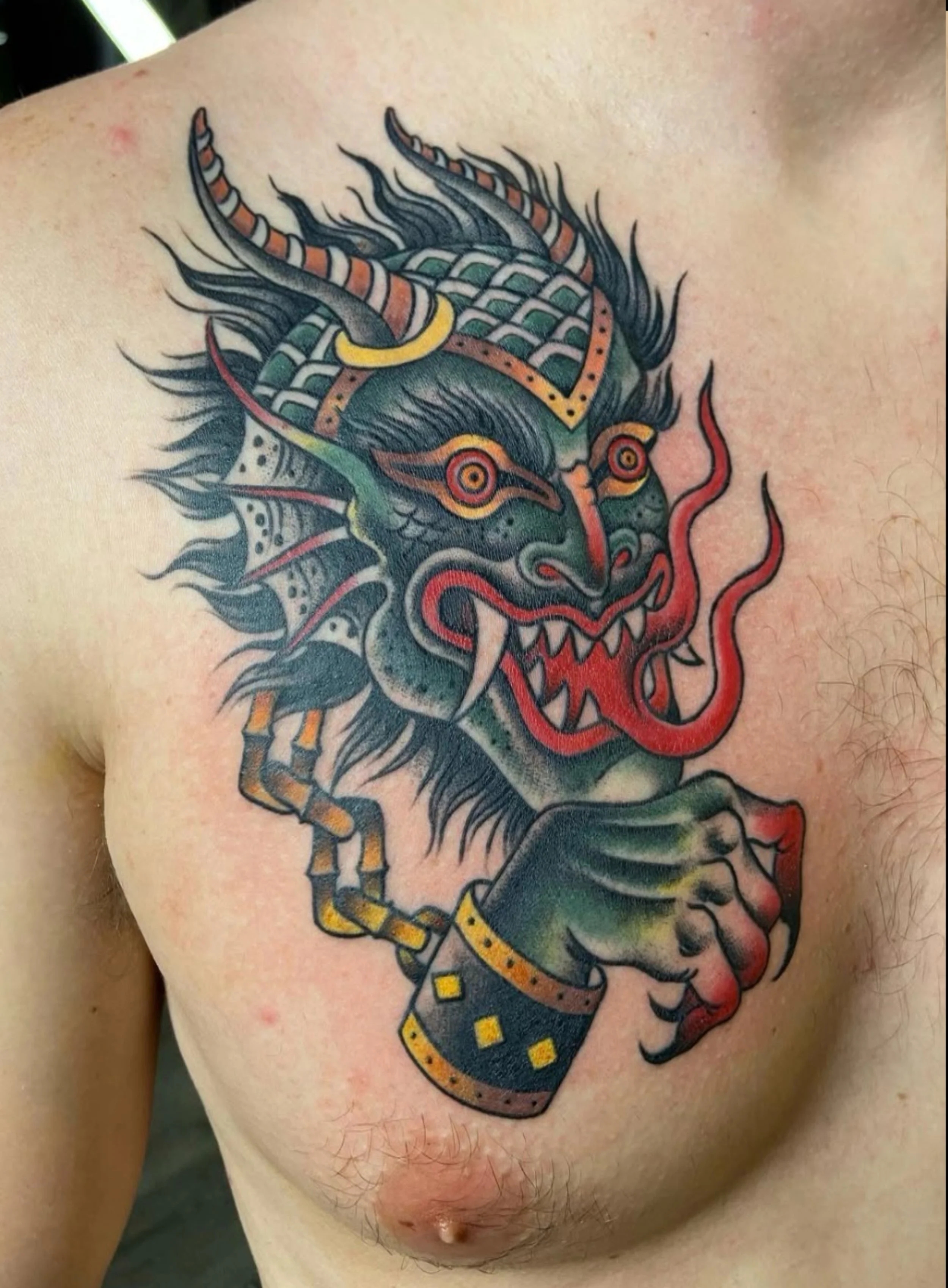 american traditional devil head and hand tattoo