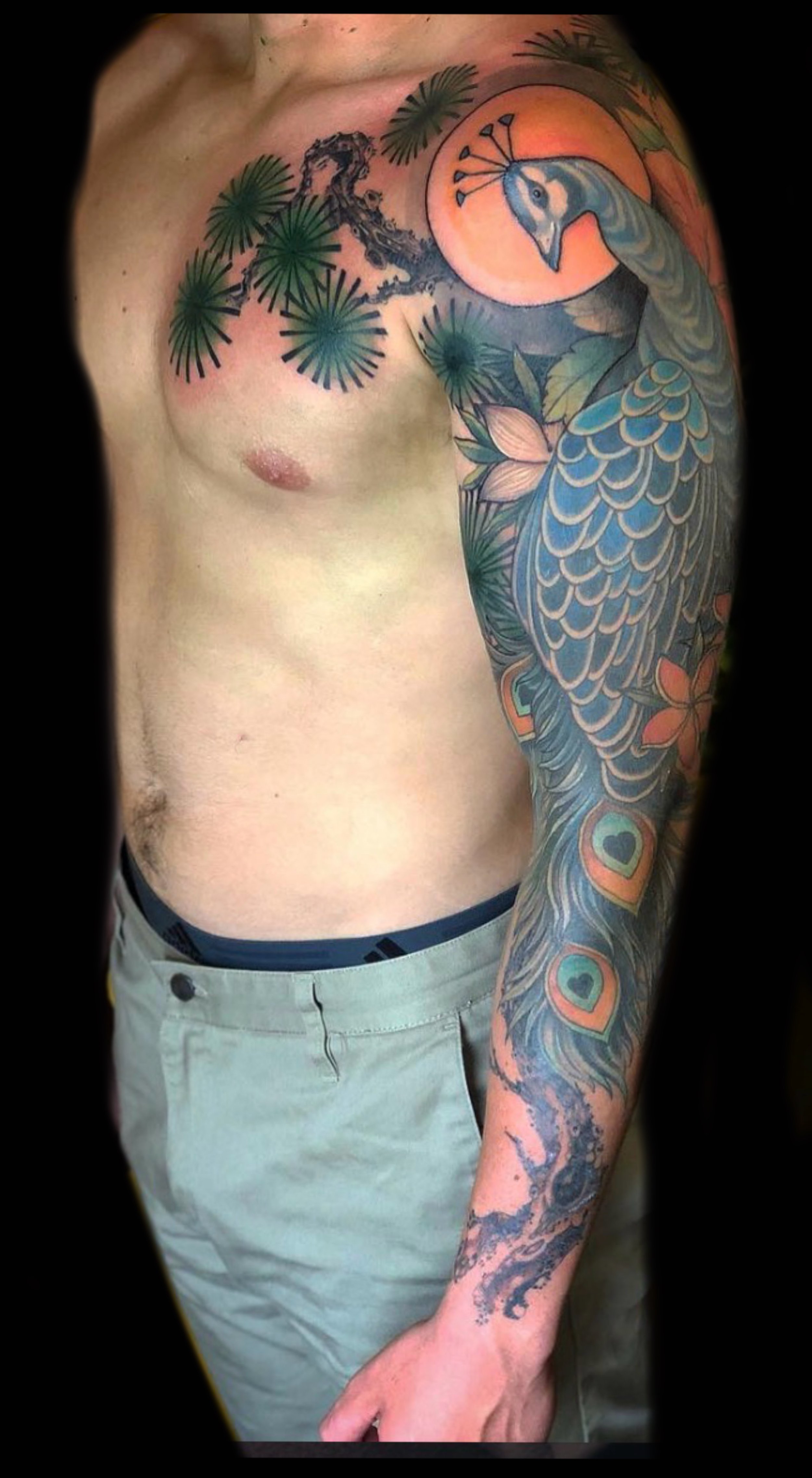A Japanese style tattoo of a peacock sleeve by Marie Makowski