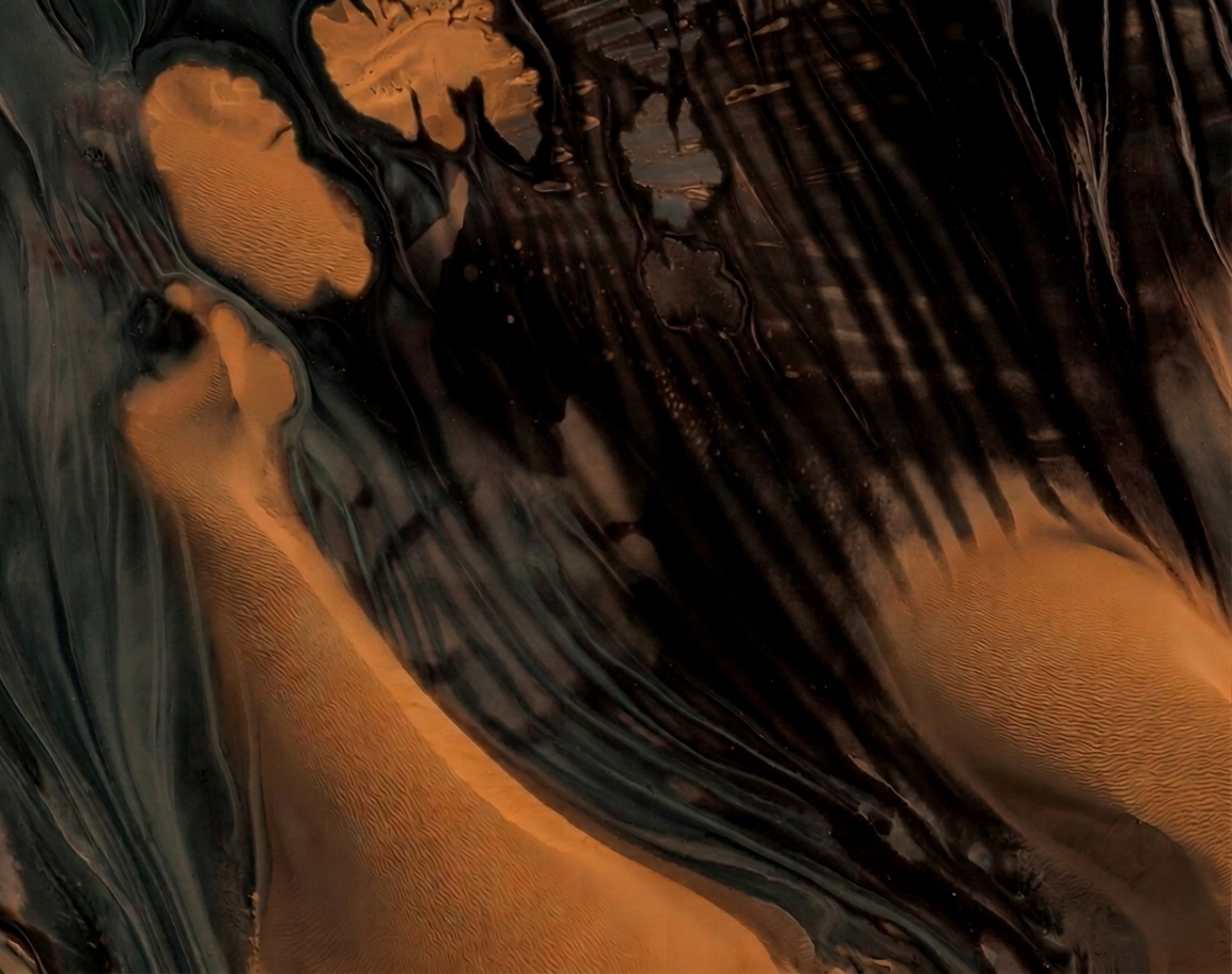 Abstract swirling patterns in black, gold, and orange resembling marble or fluid art.