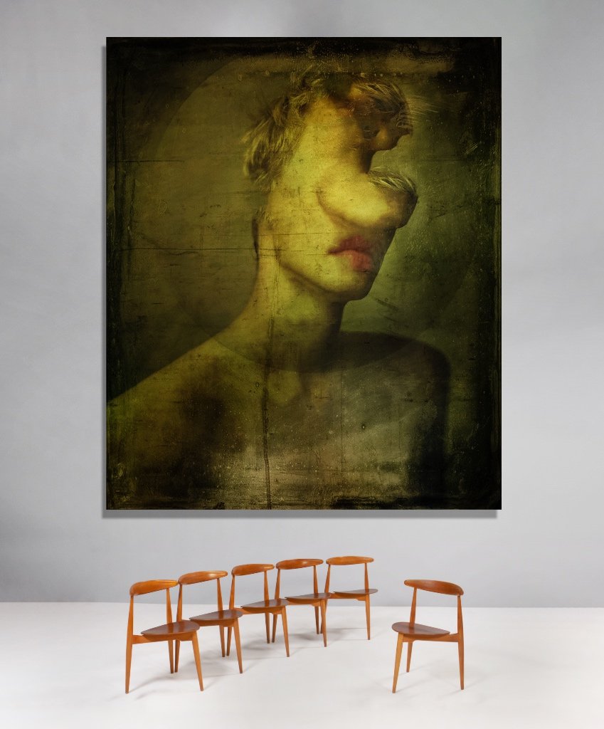 Large artwork of a woman with short hair, her face partially obscured and her head turned to the side, hanging on a white gallery wall. Five wooden chairs are arranged in front of the artwork.
