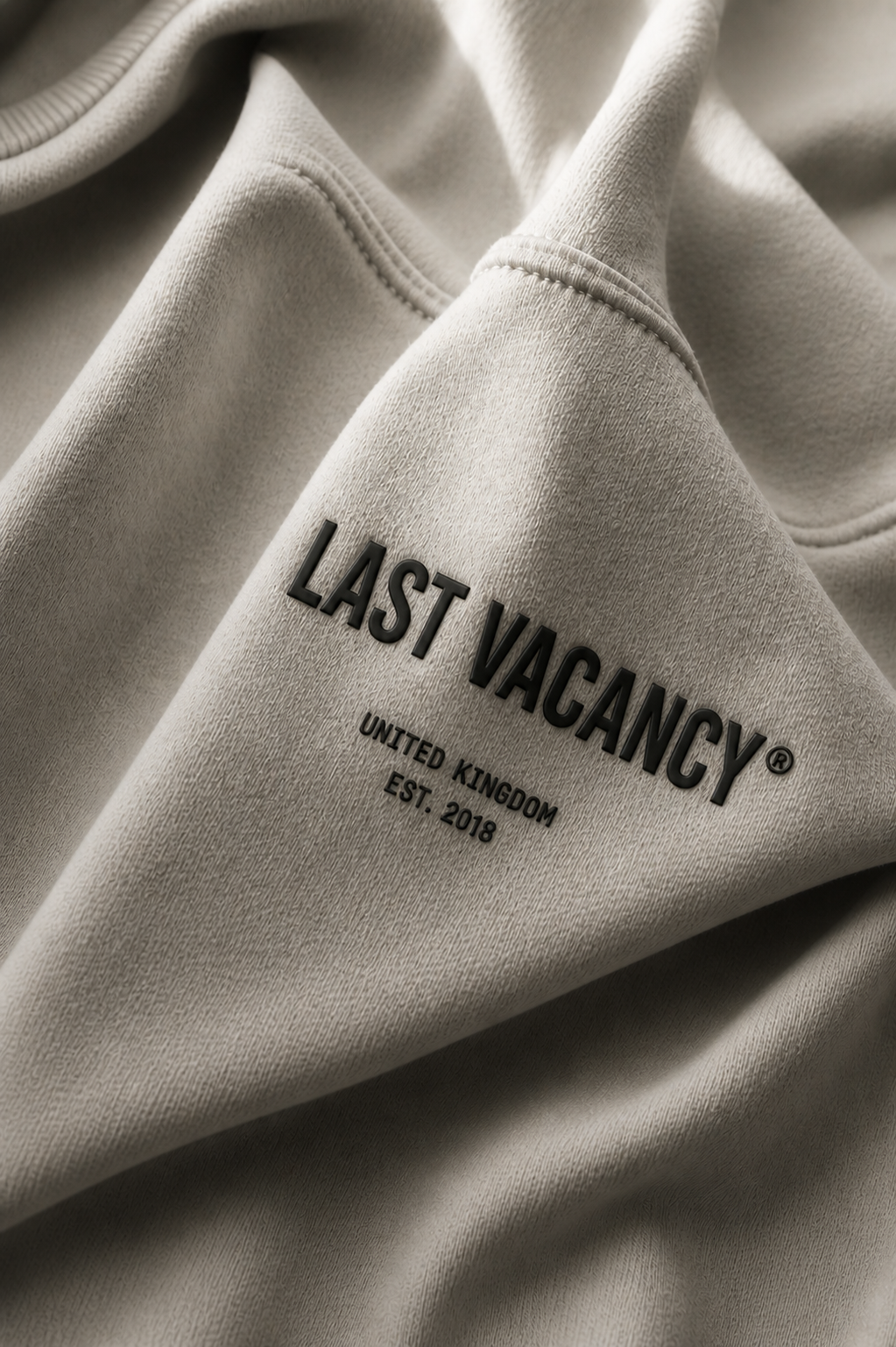 Soft fabric with embossed logo detail.png