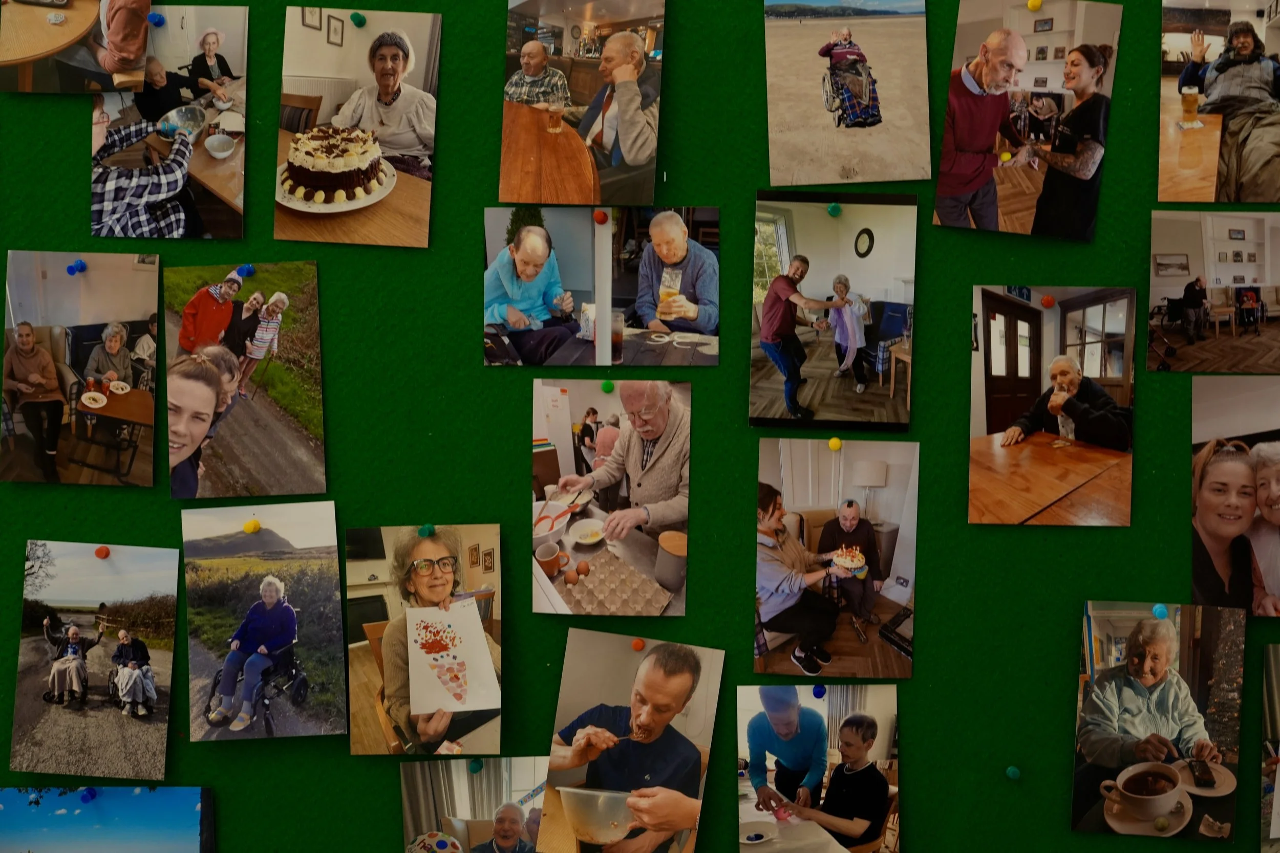 A collage of various photos pinned to a green board, featuring people celebrating birthdays, socializing, and enjoying meals indoors and outdoors.