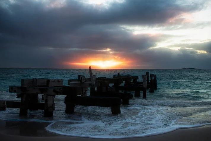 Sunset silhouettes and seaside whispers