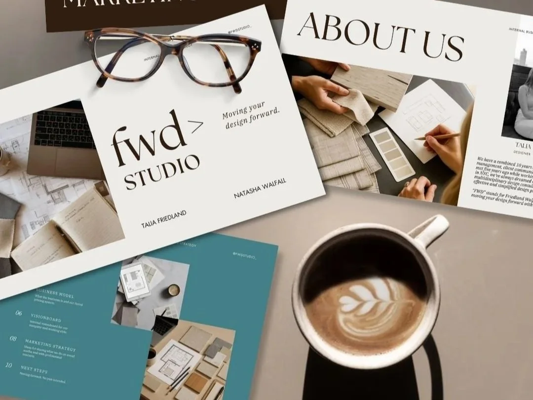 Copy of a marketing or branding brochure for 'fwd STUDIO' with glasses placed on top, a cup of coffee with latte art on a table, and other printed materials including newspapers, a laptop, and design samples.