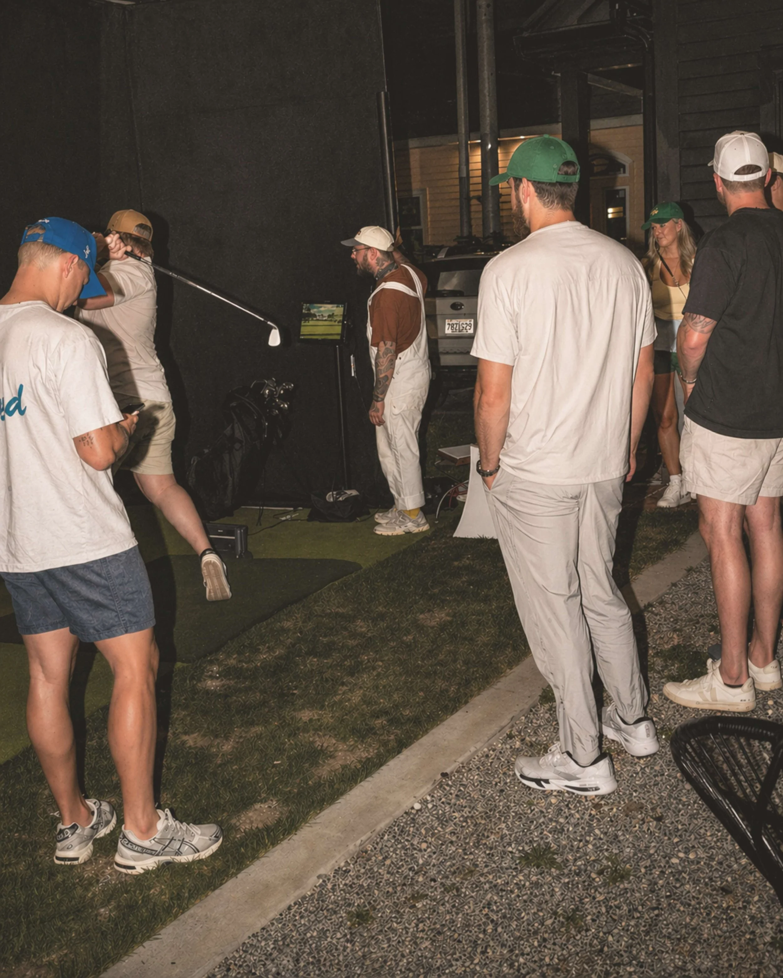Guests gathered around the Lemont Golf simulator during a Nashville private event activation
