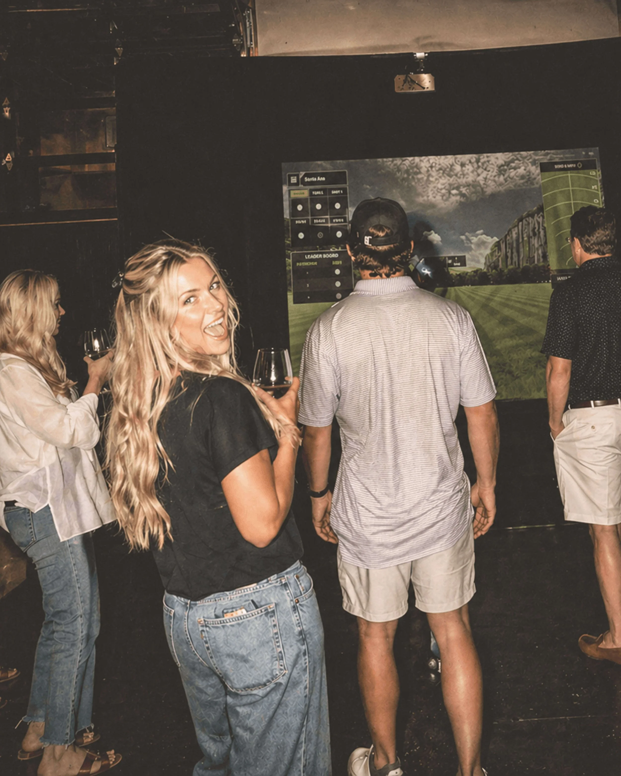 Guests watching and reacting at a Lemont Golf corporate event activation in Nashville