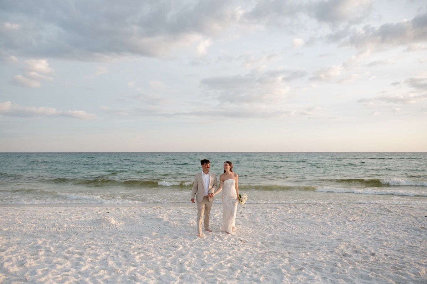 Walking on the beach after saying I do !!! 🦪