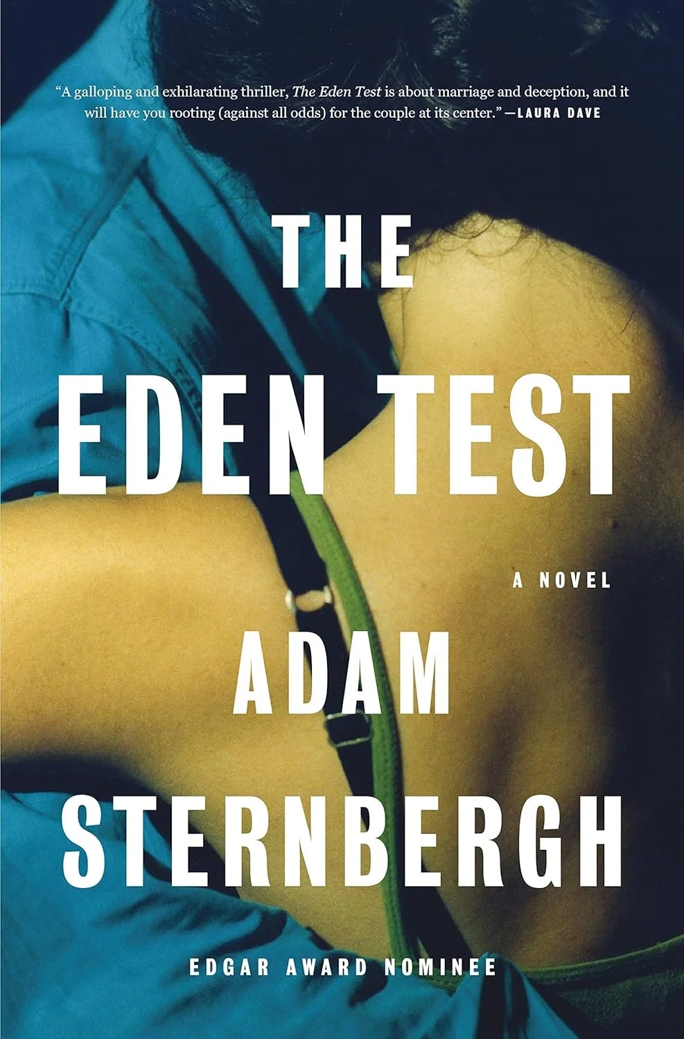 Book cover of 'The Eden Test' by Adam Sternbergh featuring a close-up of a person with a yellow shirt and a blue jacket resting their head on their knees.