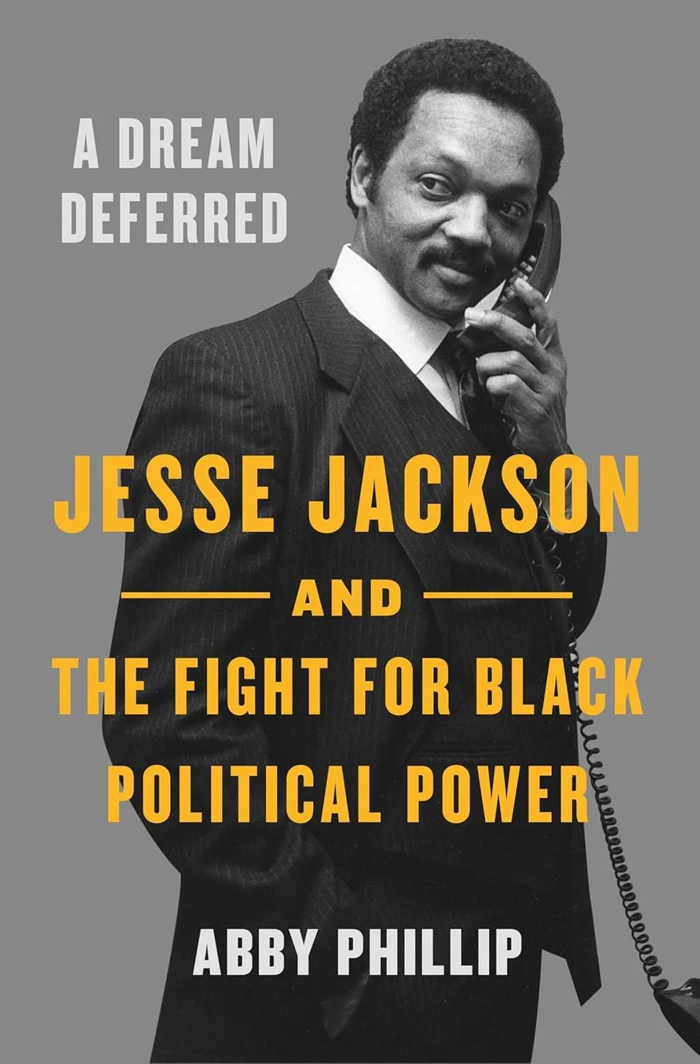 Book cover featuring a black and white photo of Jesse Jackson holding a telephone, with the title 'A Dream Deferred: Jesse Jackson and the Fight for Black Political Power' by Abby Phillip.