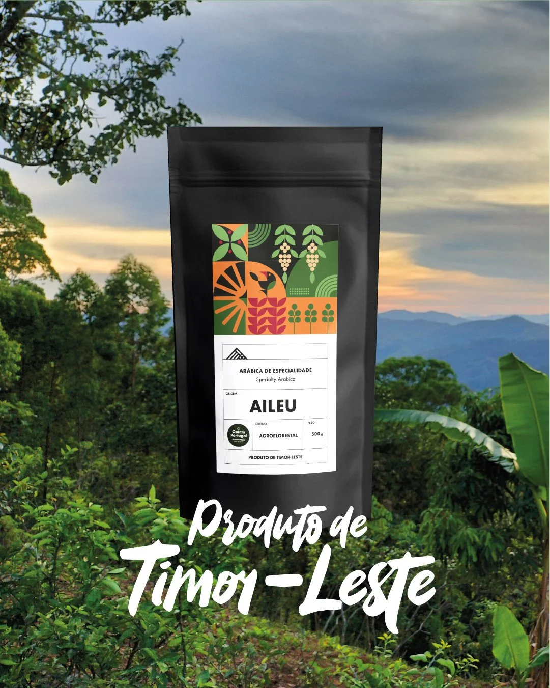 Black package of Arabica coffee beans from Timor-Leste with colorful artwork of a tiger, plants, and mountains, set against a lush green landscape with hills and trees at sunset.