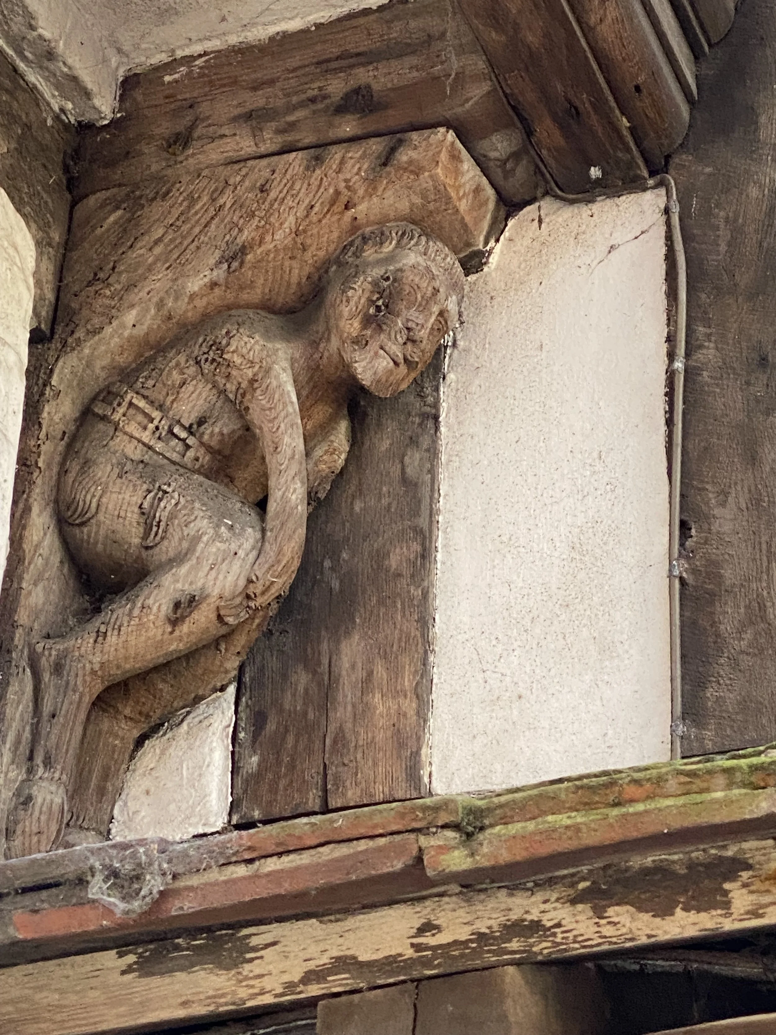 Close-up of a carved wooden sculpture on Bull House, Lewes