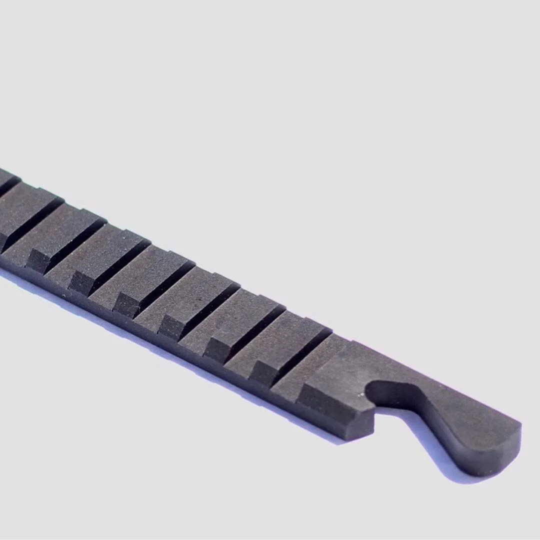 Close-up of the bottle opener hook and rail-style slots