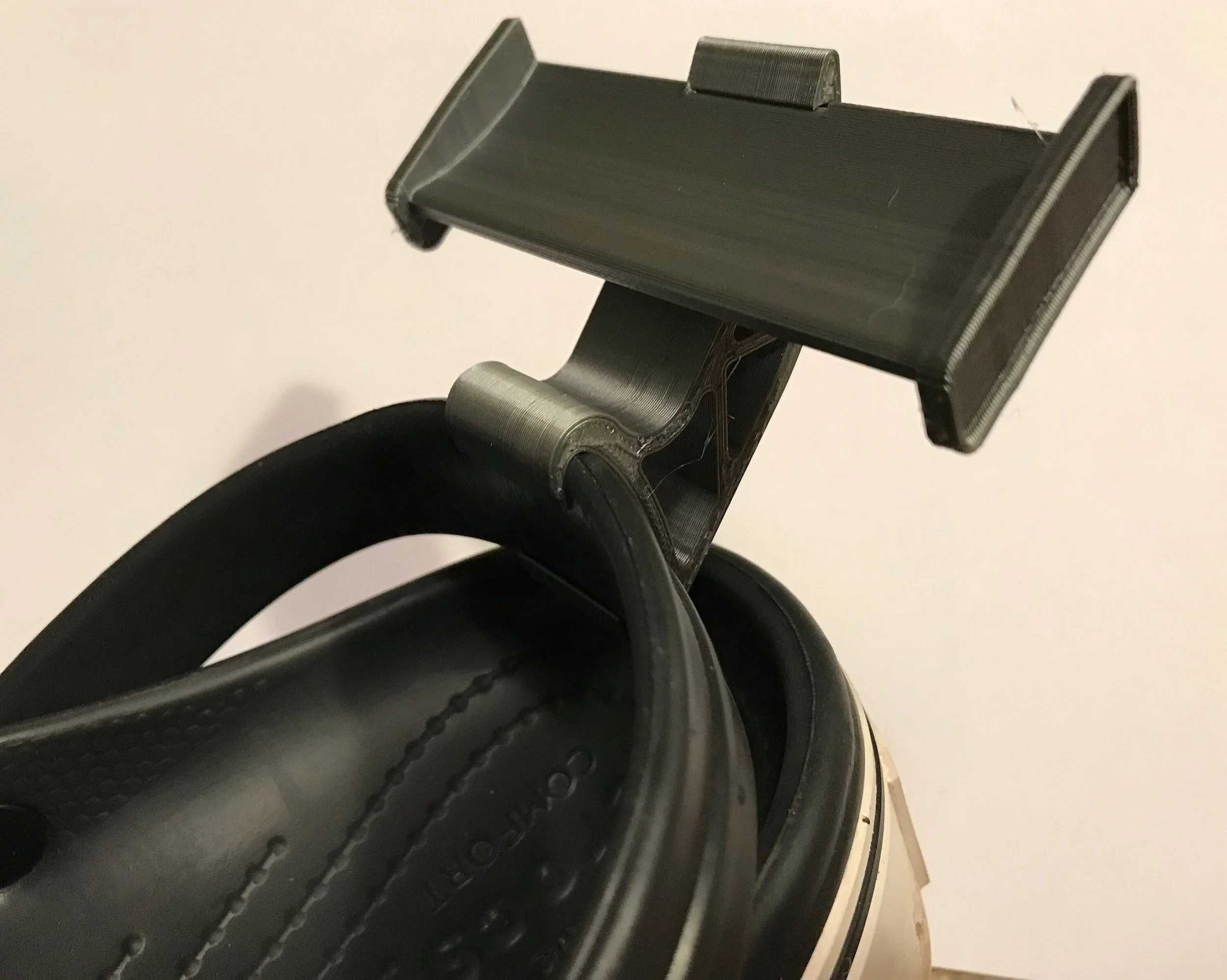 Black Croc spoiler clipped onto the heel strap of a black Croc