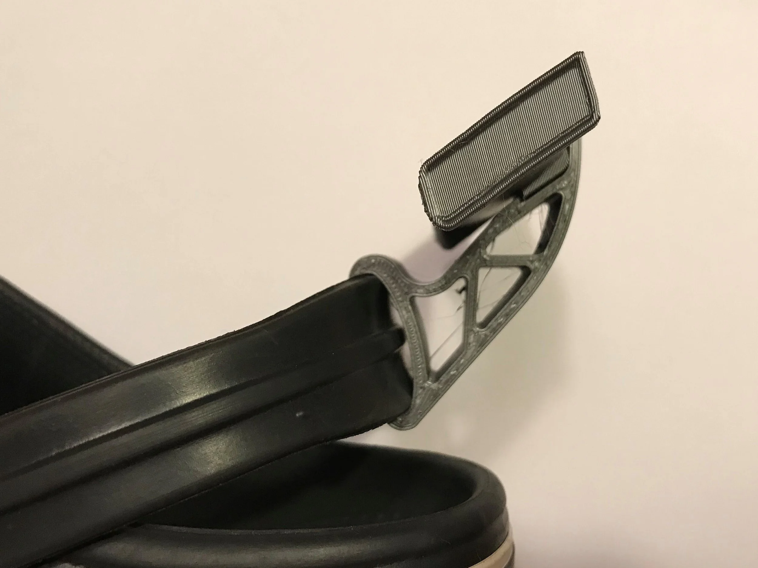 Gray Croc spoiler on a Croc heel strap, side view