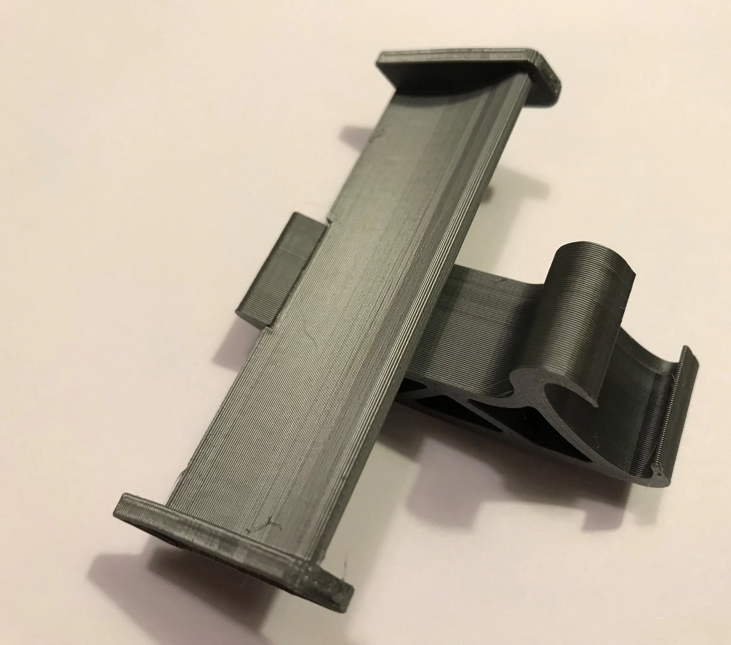 Close-up of a gray Croc spoiler showing the strap clip