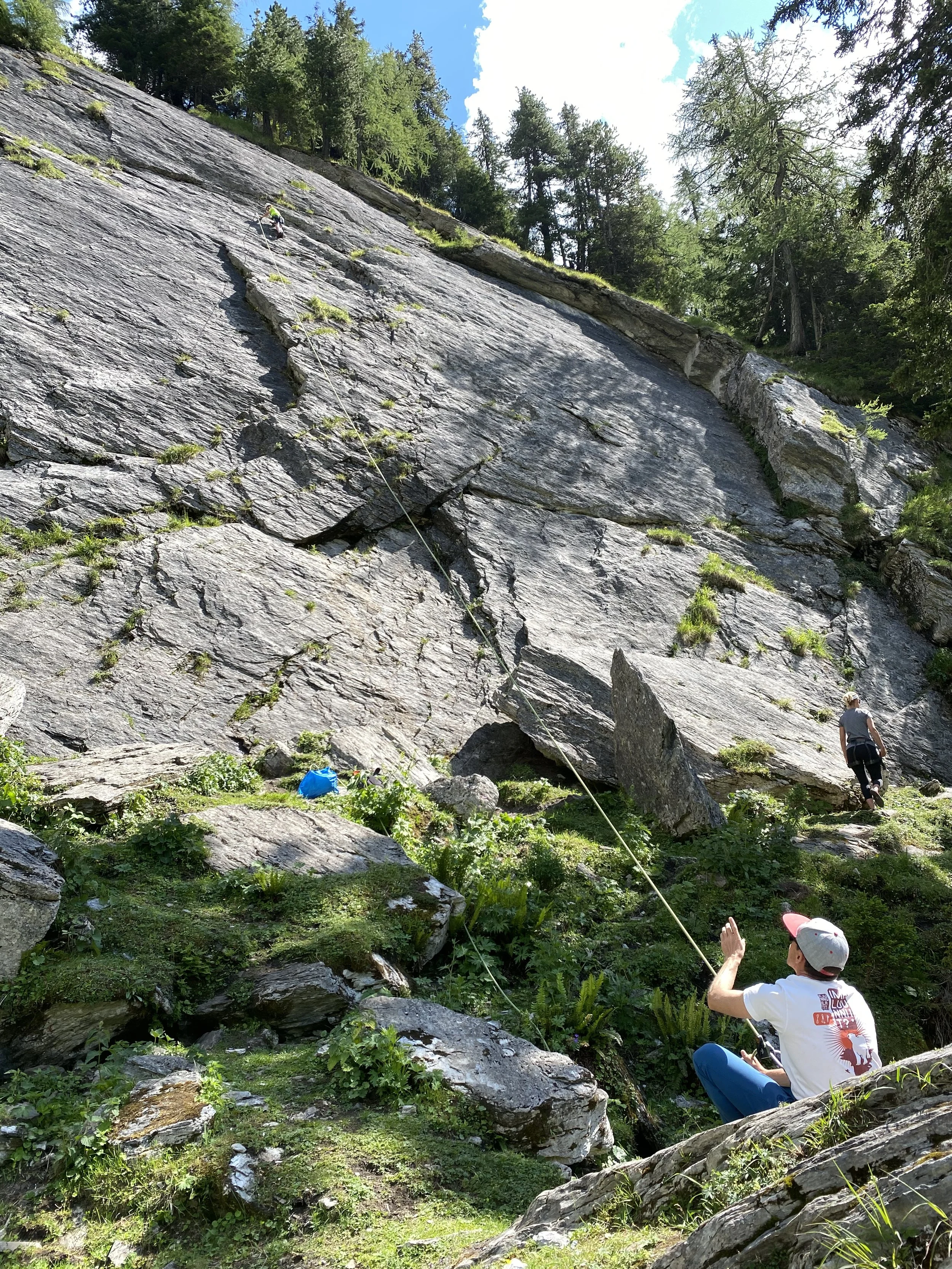Climber scaling a rock wall near Verbier, Switzerland