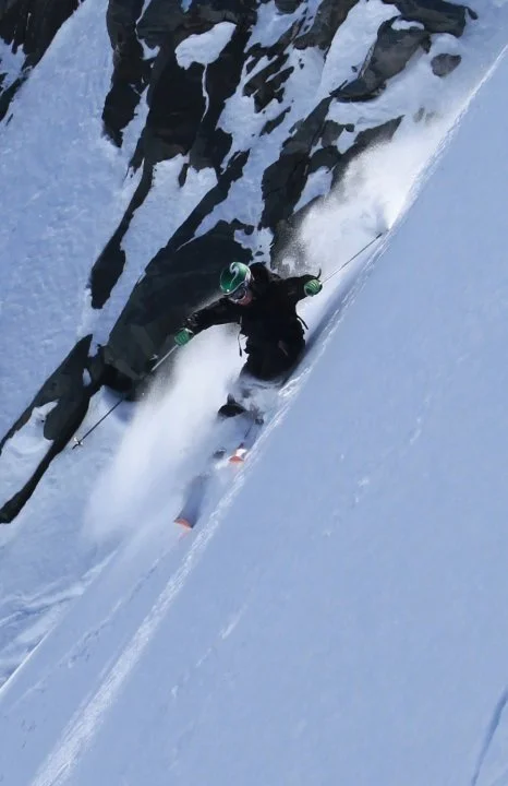 Skier at the top of the Bec des Étagnes on a powder day, Mont Fort area, Verbier Switzerland