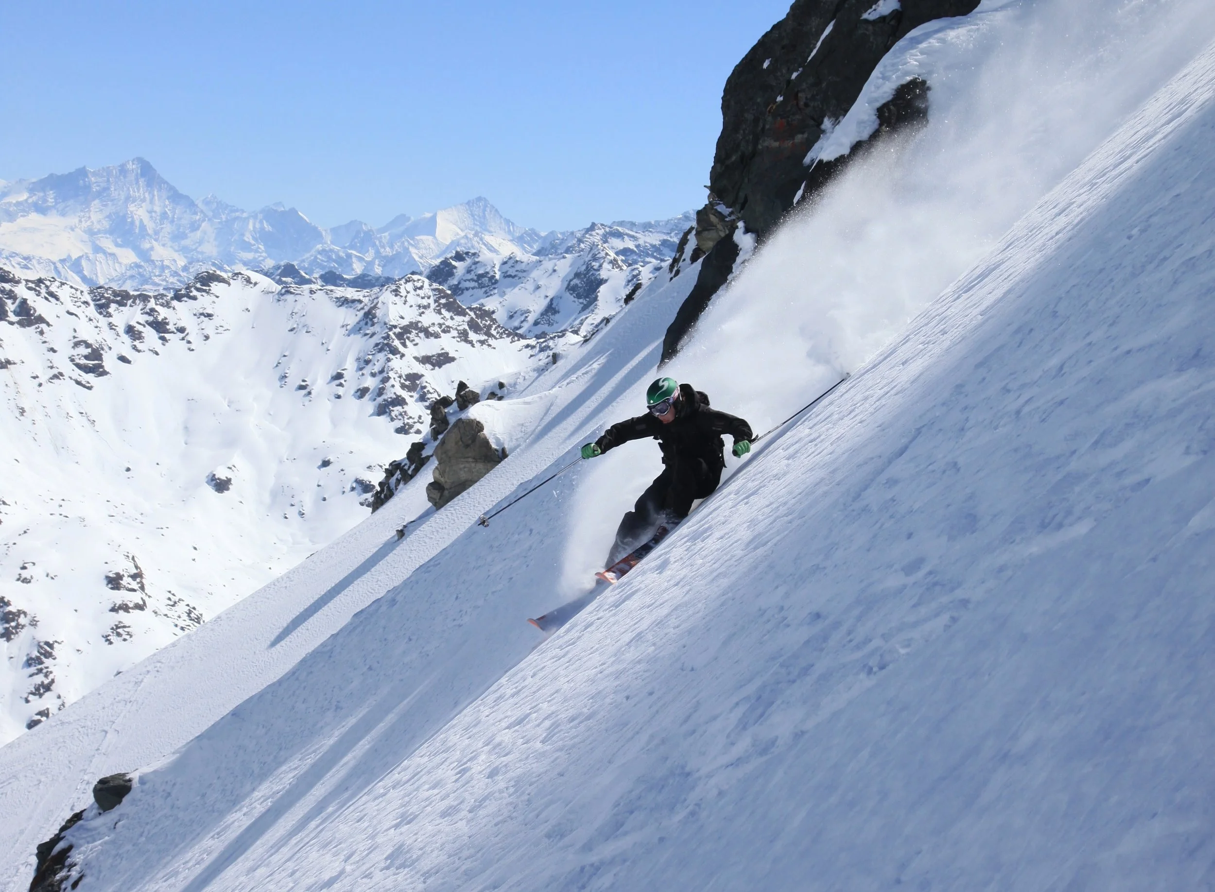 Skier descending the Bec des Étagnes off-piste, Mont Fort area, Verbier Switzerland